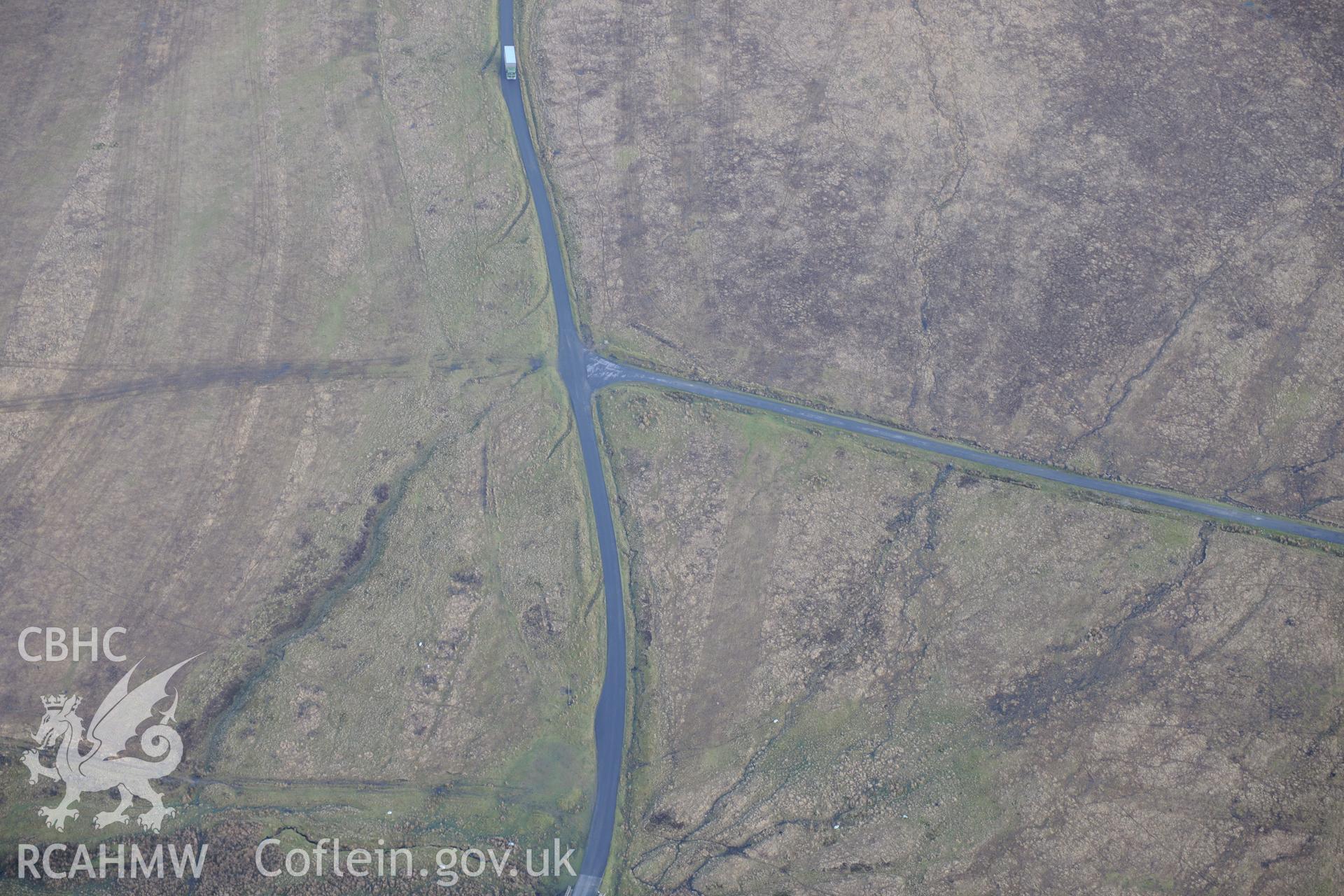 Crug-y-Biswall, Llanllwni. Oblique aerial photograph taken during the Royal Commission's programme of archaeological aerial reconnaissance by Toby Driver on 6th January 2015.