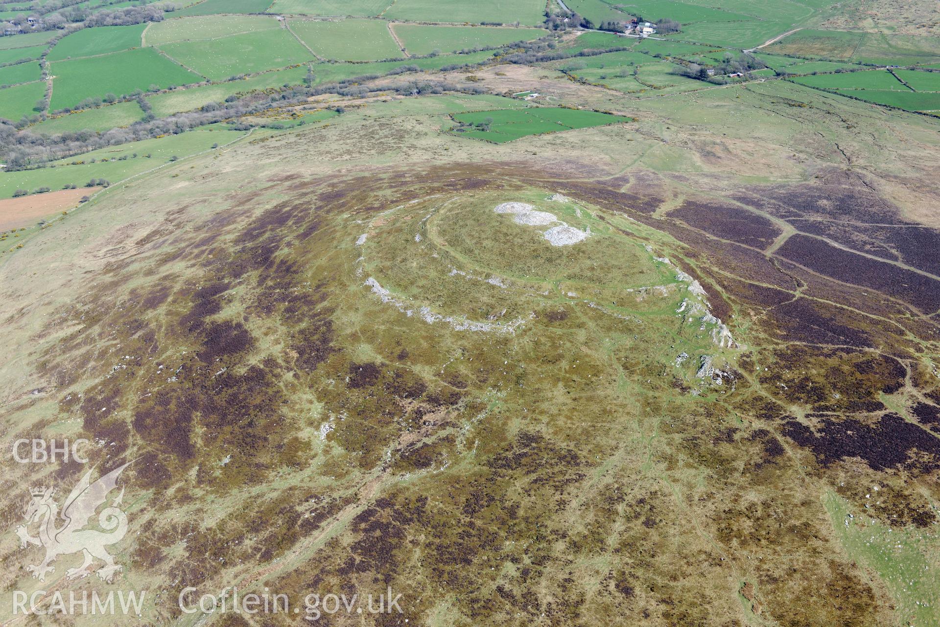 Moel Trigarn Hillfort, East Cairn and West Cairn. Oblique aerial photograph taken during the Royal Commission's programme of archaeological aerial reconnaissance by Toby Driver on 15th April 2015.