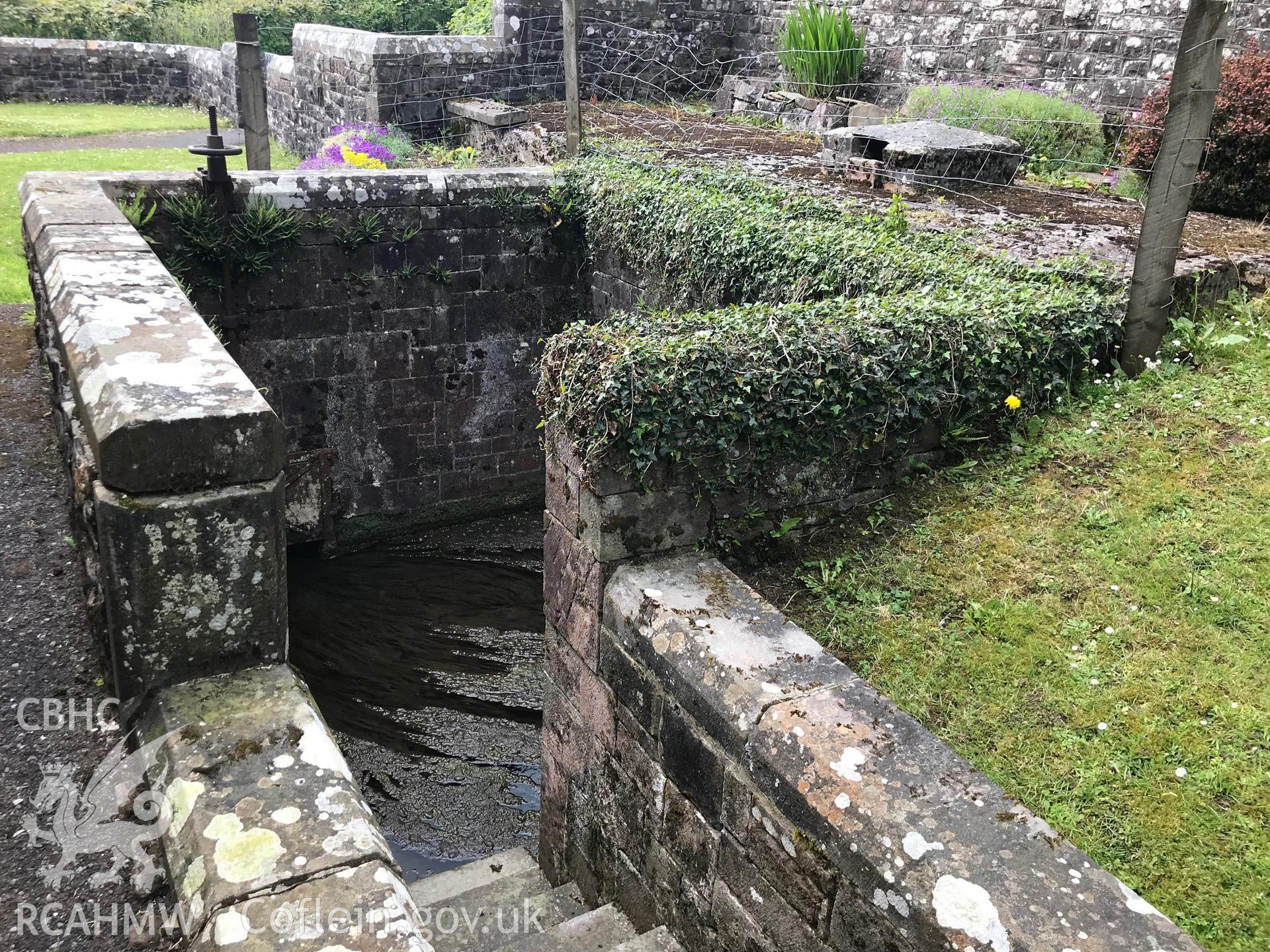 Digital colour photograph showing St Dyfan's well at St Dyfan's Church, Llandyfan, taken by Paul R. Davis on 7th May 2019.