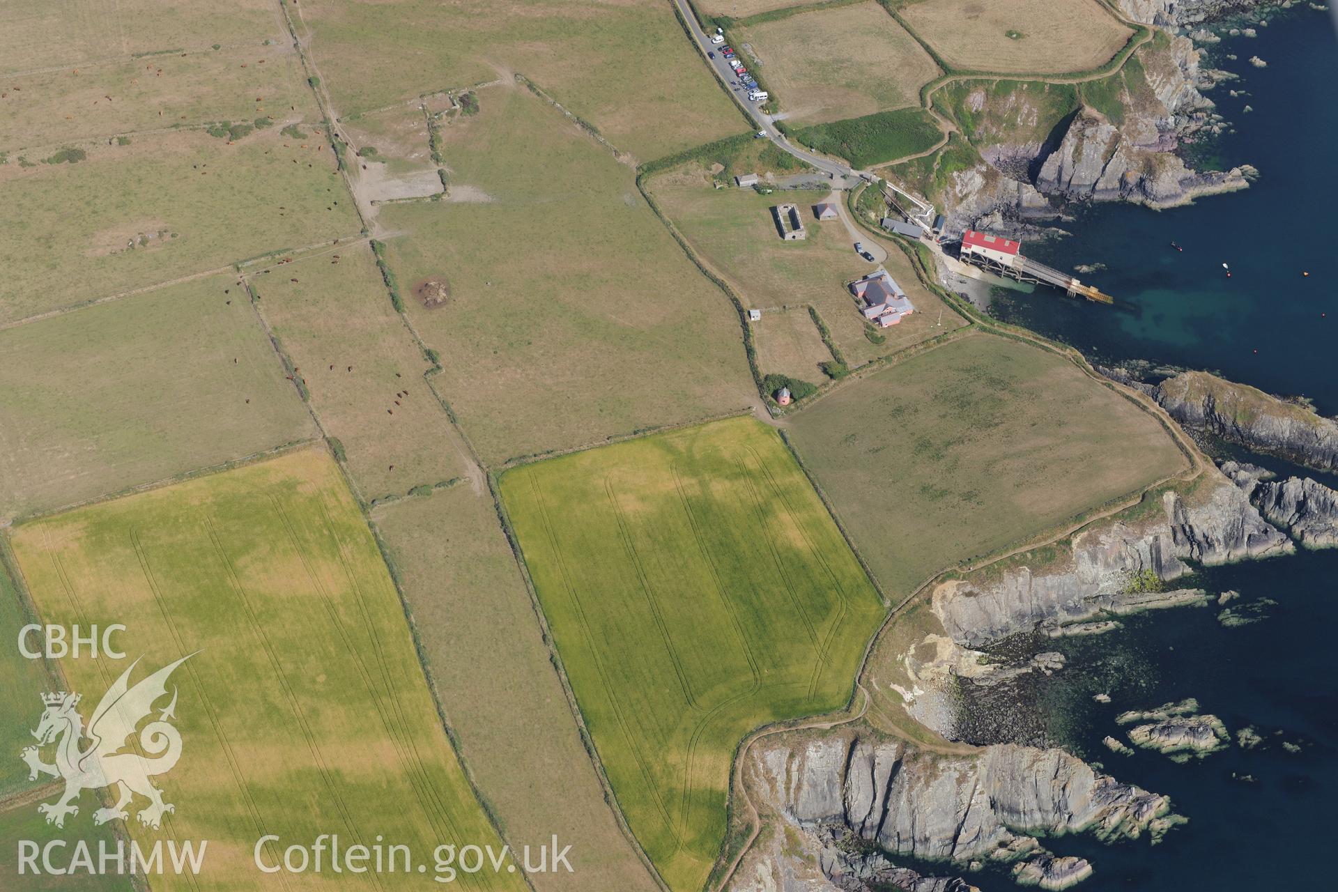 St David's lifeboat station and new lifeboat station; St Justinian's bungalow; St Justinian's chapel and St Justinian's well. Oblique aerial photograph taken during the Royal Commission?s programme of archaeological aerial reconnaissance by Toby Driver on 16th July 2013.