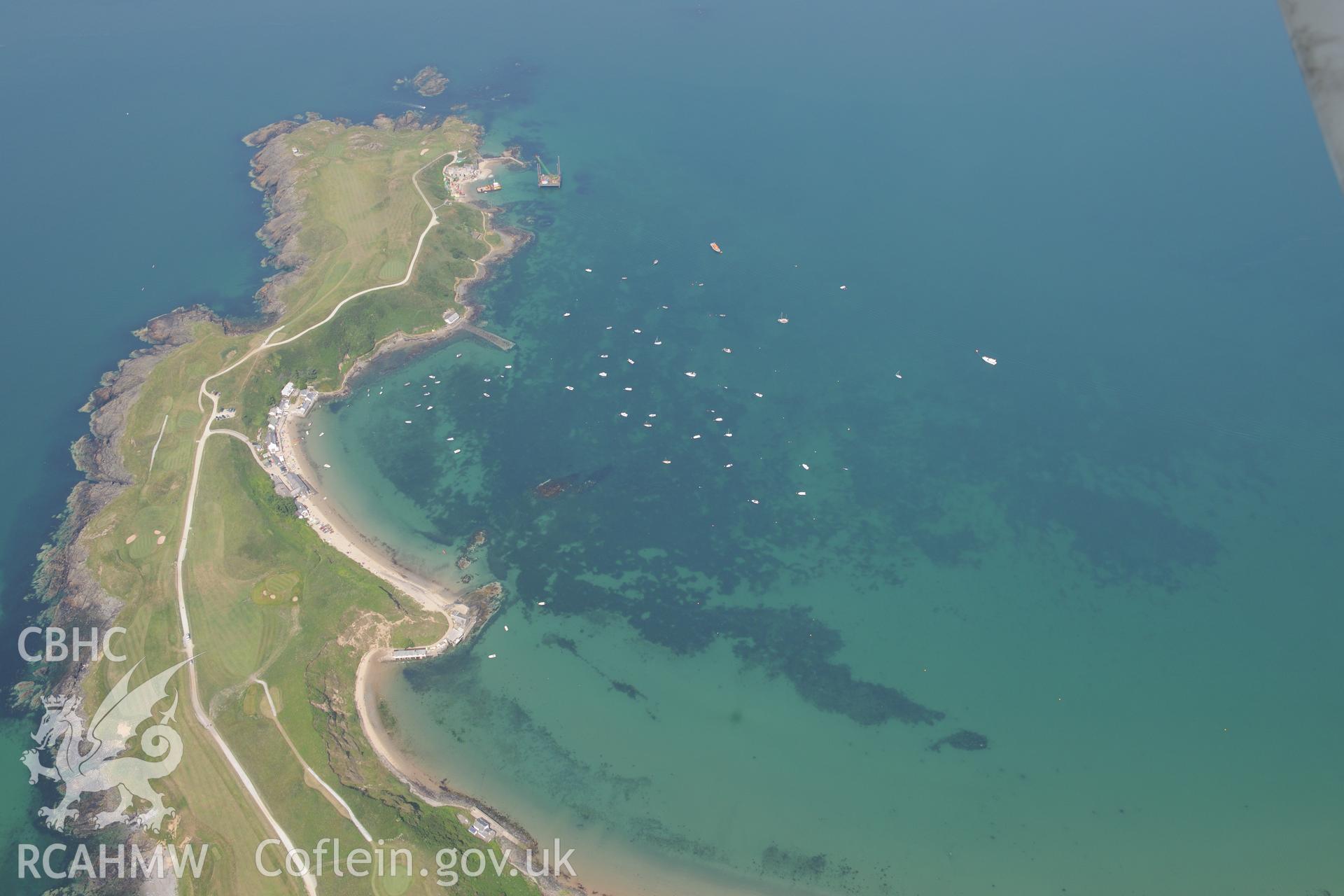 Lifeboat House, Lighthouse, Old Pier, Trwyn Porth Dinllaen Promontory Enclosure and Porth Dinllaen village. Oblique aerial photograph taken during the Royal Commission?s programme of archaeological aerial reconnaissance by Toby Driver on 12th July 2013.