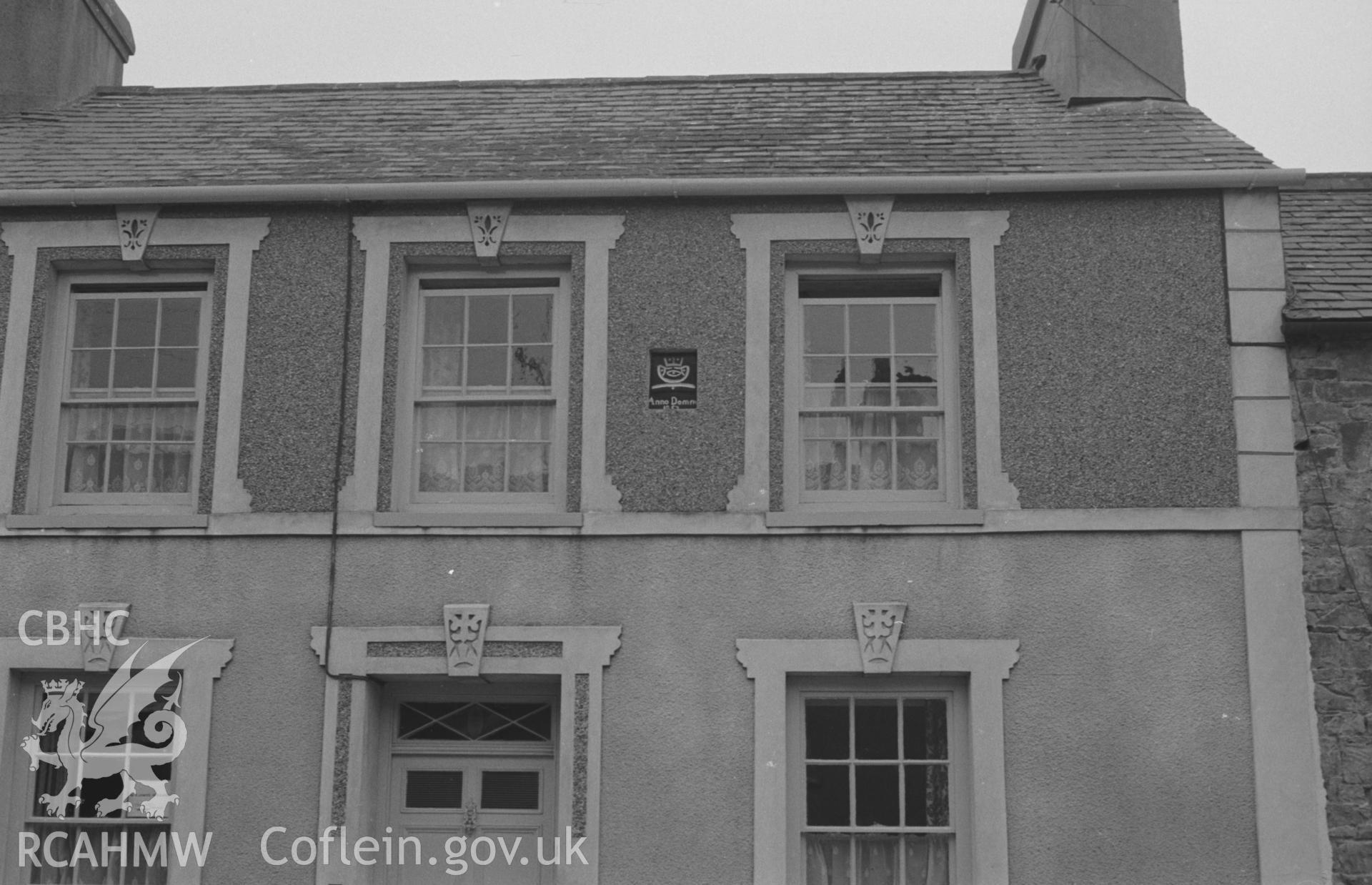 Digital copy of a black and white negative showing 'Anno Domine' on small plaque in wall of a house at the bottom of Llanarth main street. Photographed by Arthur O. Chater on 13th April 1967 looking north west from Grid Reference SN 424 577.