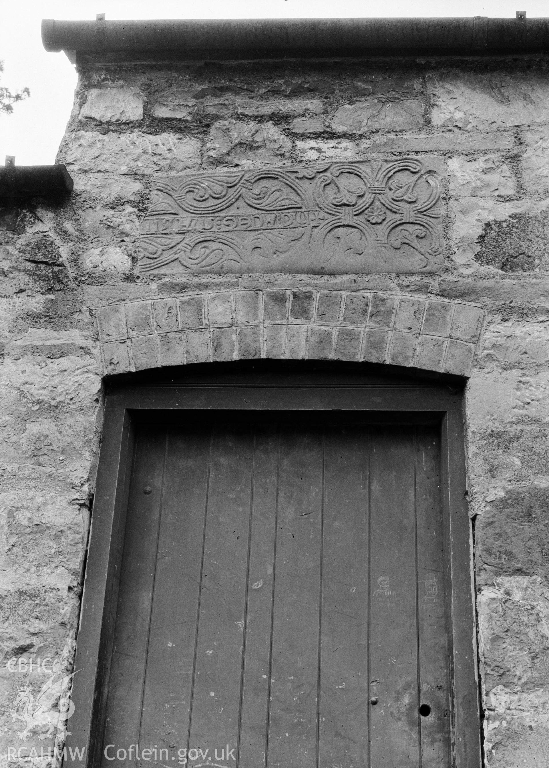 Digital copy of a nitrate negative showing view of inscribed stones in vicarage wall at the Friary near Rhuddlan Church, taken by Leonard Monroe.