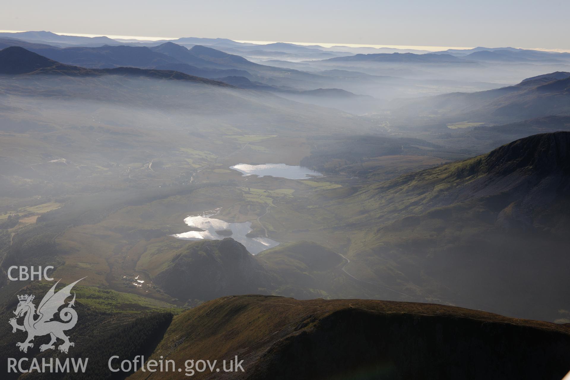 View looking south at Llyn y Cader with Llyn y Dywarchen and Beddgelert forest beyond, near the village of Rhyd-du, Snowdonia. Oblique aerial photograph taken during the Royal Commission's programme of archaeological aerial reconnaissance by Toby Driver on 2nd October 2015.