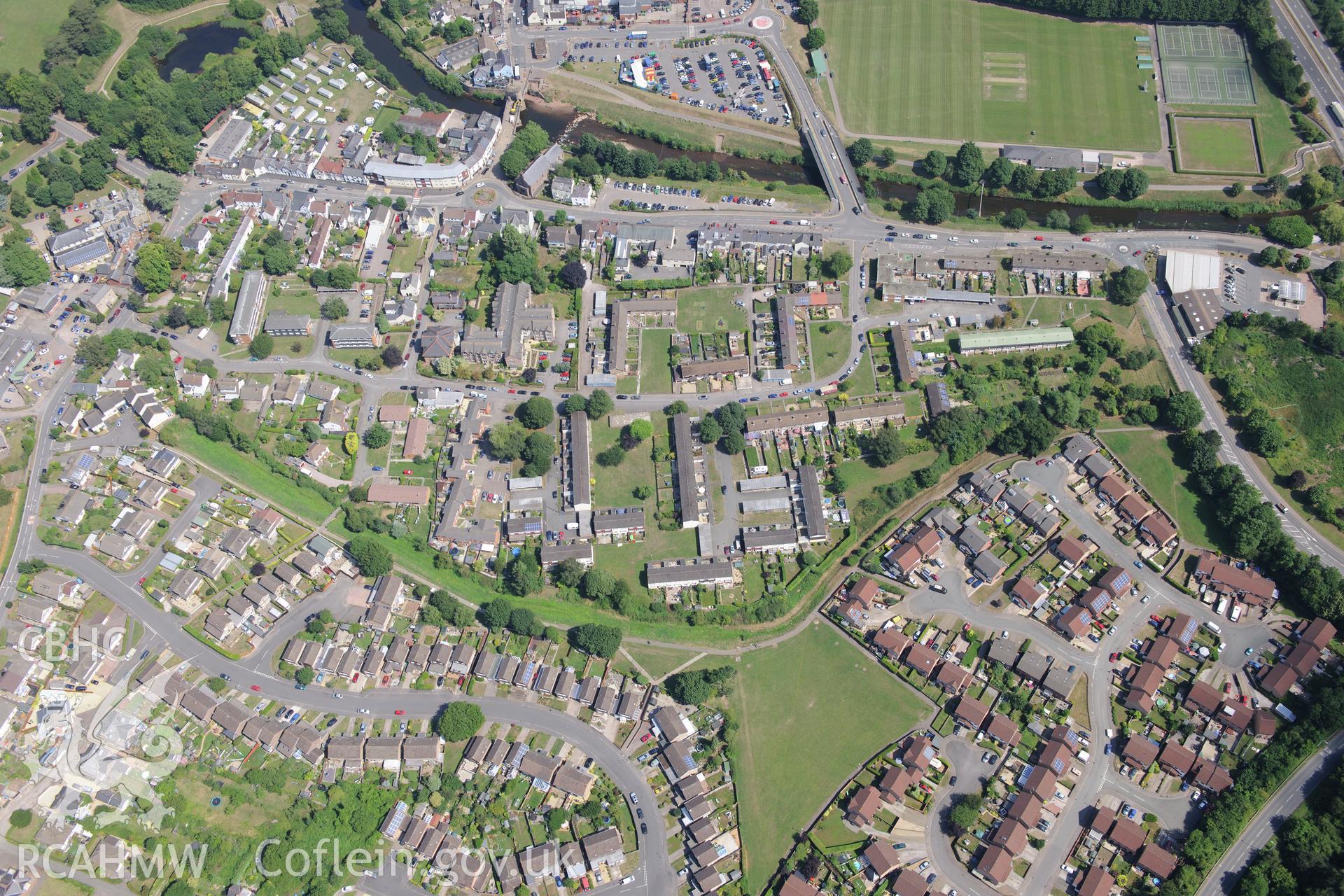 Clawdd Du town defences (grassy bank in centre of photograph), Monmouth. Oblique aerial photograph taken during the Royal Commission?s programme of archaeological aerial reconnaissance by Toby Driver on 1st August 2013.