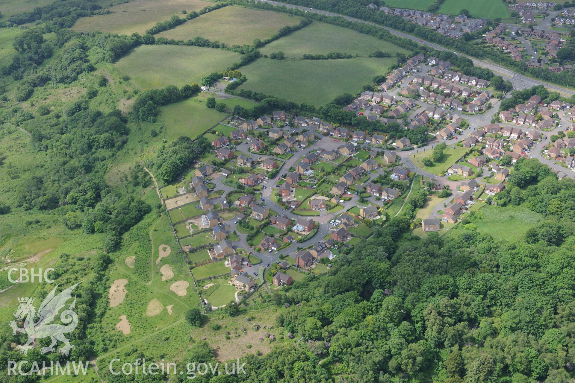 Penllergaer Park and the village of Penllergaer. Oblique aerial photograph taken during the Royal Commission's programme of archaeological aerial reconnaissance by Toby Driver on 19th June 2015.