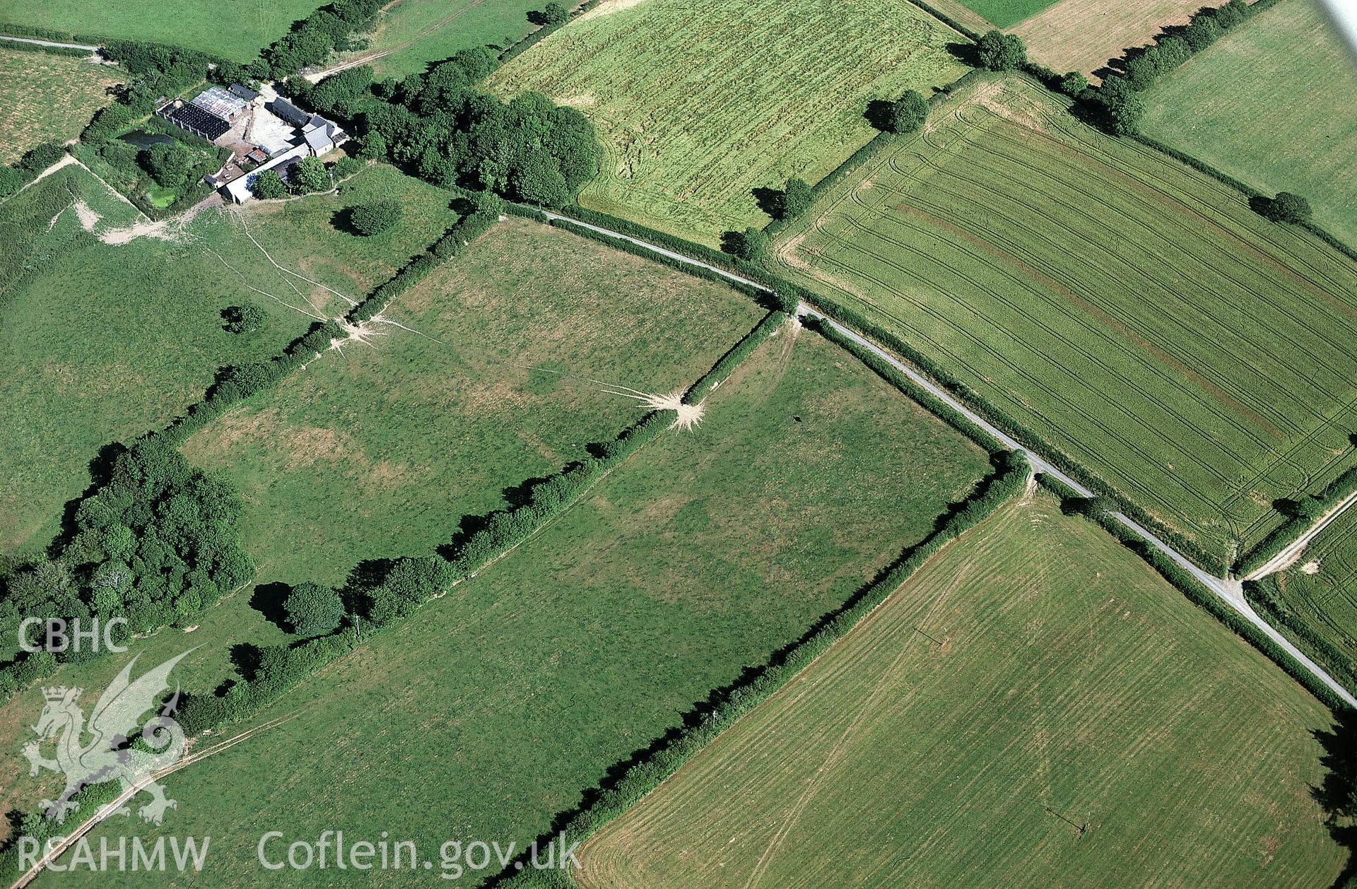 RCAHMW colour slide oblique aerial photograph of possible Roman road features at Longlands, Wiston, taken by C.R.Musson on the 25/07/1996