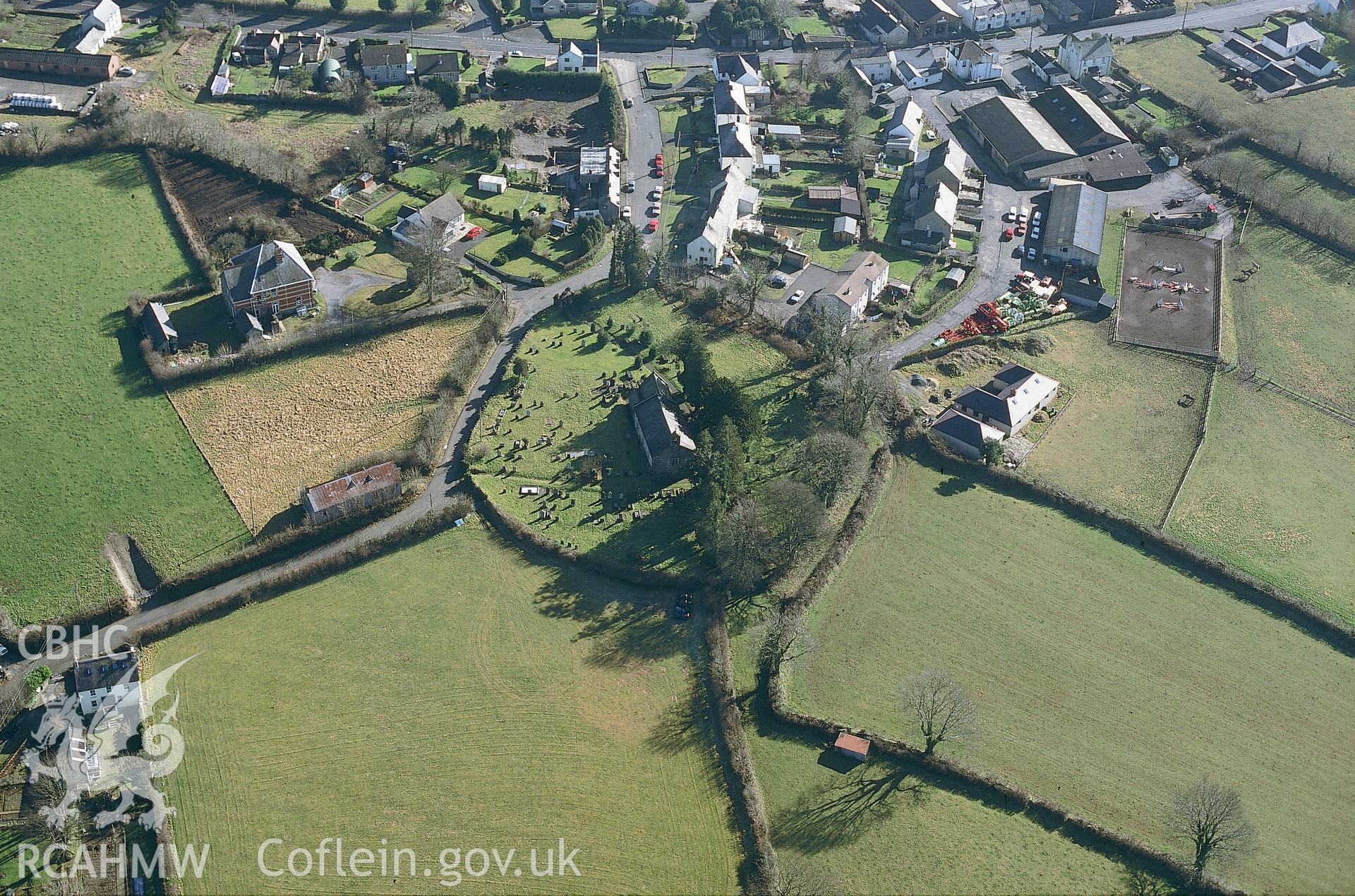 RCAHMW colour slide oblique aerial photograph of St Tyssilio's Church, Llandissilo West, taken by C.R.Musson on the 27/02/1996