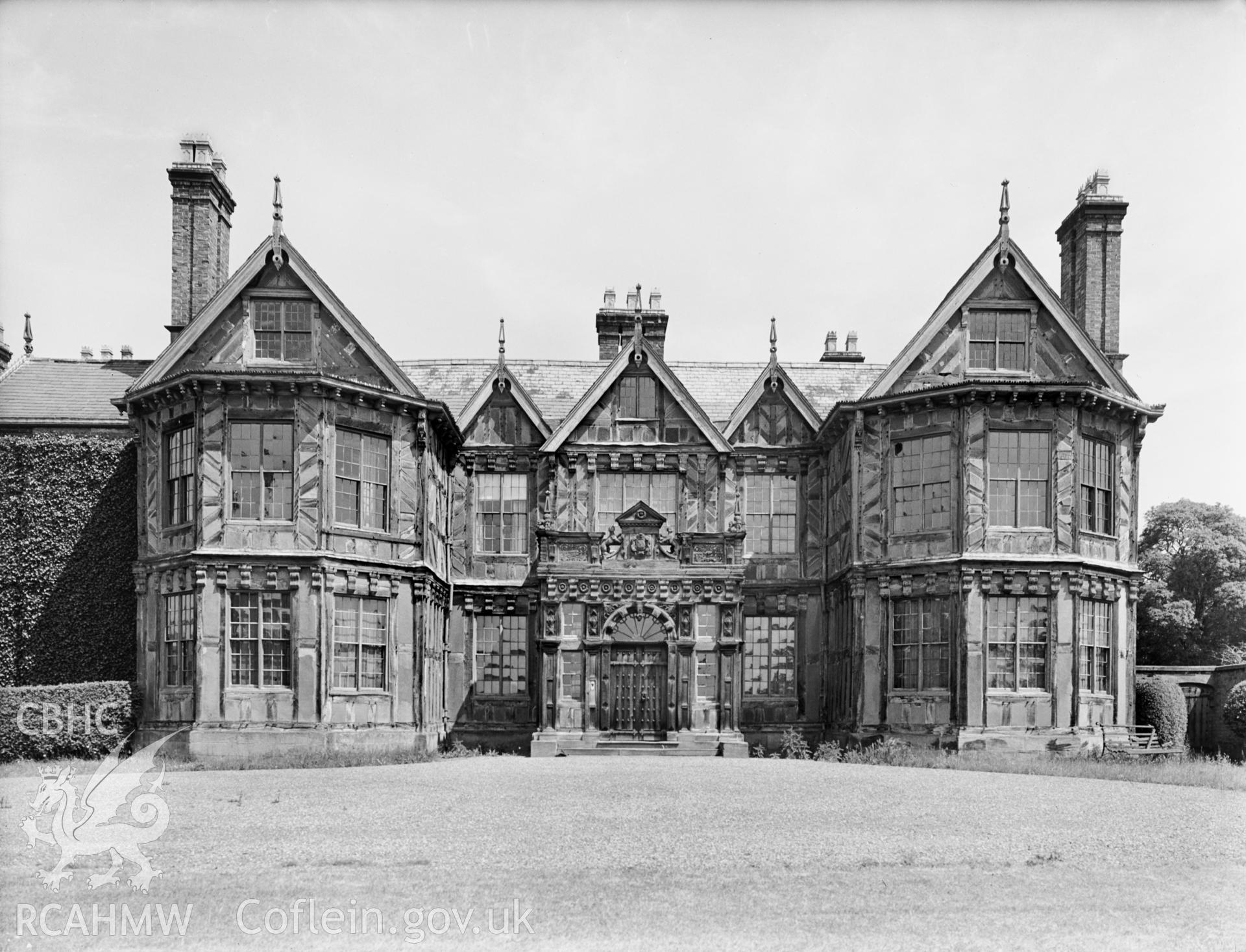 A view showing the front bay windows. Also visible is the large front porch.