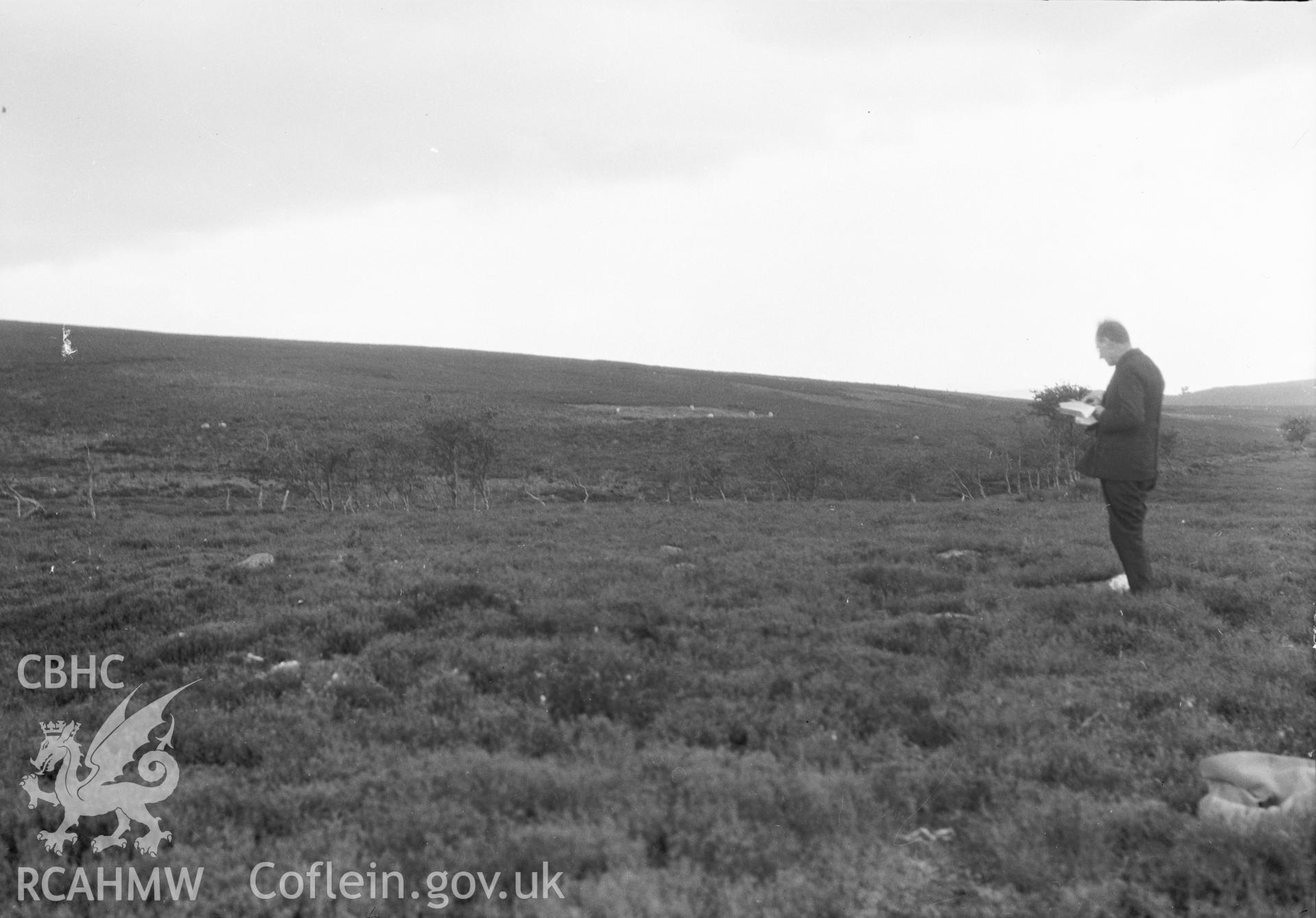 Digital copy of a nitrate negative showing Bryn Beddau round barrows. Back of negative copy dates the photograph to 'July 1930.' From the Cadw Monuments in Care Collection.