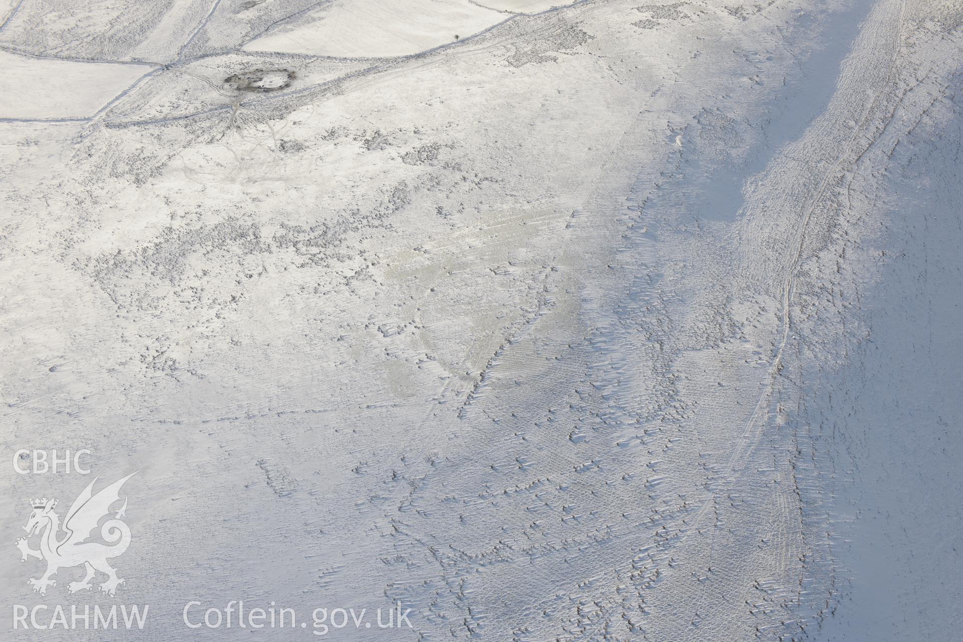 Graig Fawr (west) enclosure or possible hillfort, north of Pontarddulais. Oblique aerial photograph taken during the Royal Commission?s programme of archaeological aerial reconnaissance by Toby Driver on 24th January 2013.