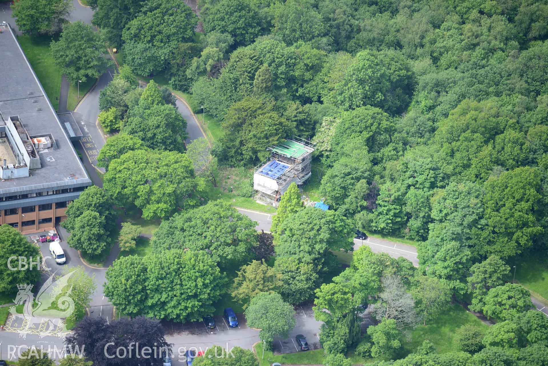 The Equatorial Observatory; Lliw Valley (or Penllergaer) civic centre and the site of Penllergaer House at Penllergaeth Park, Swansea. Oblique aerial photograph taken during the Royal Commission's programme of archaeological aerial reconnaissance by Toby Driver on 19th June 2015.