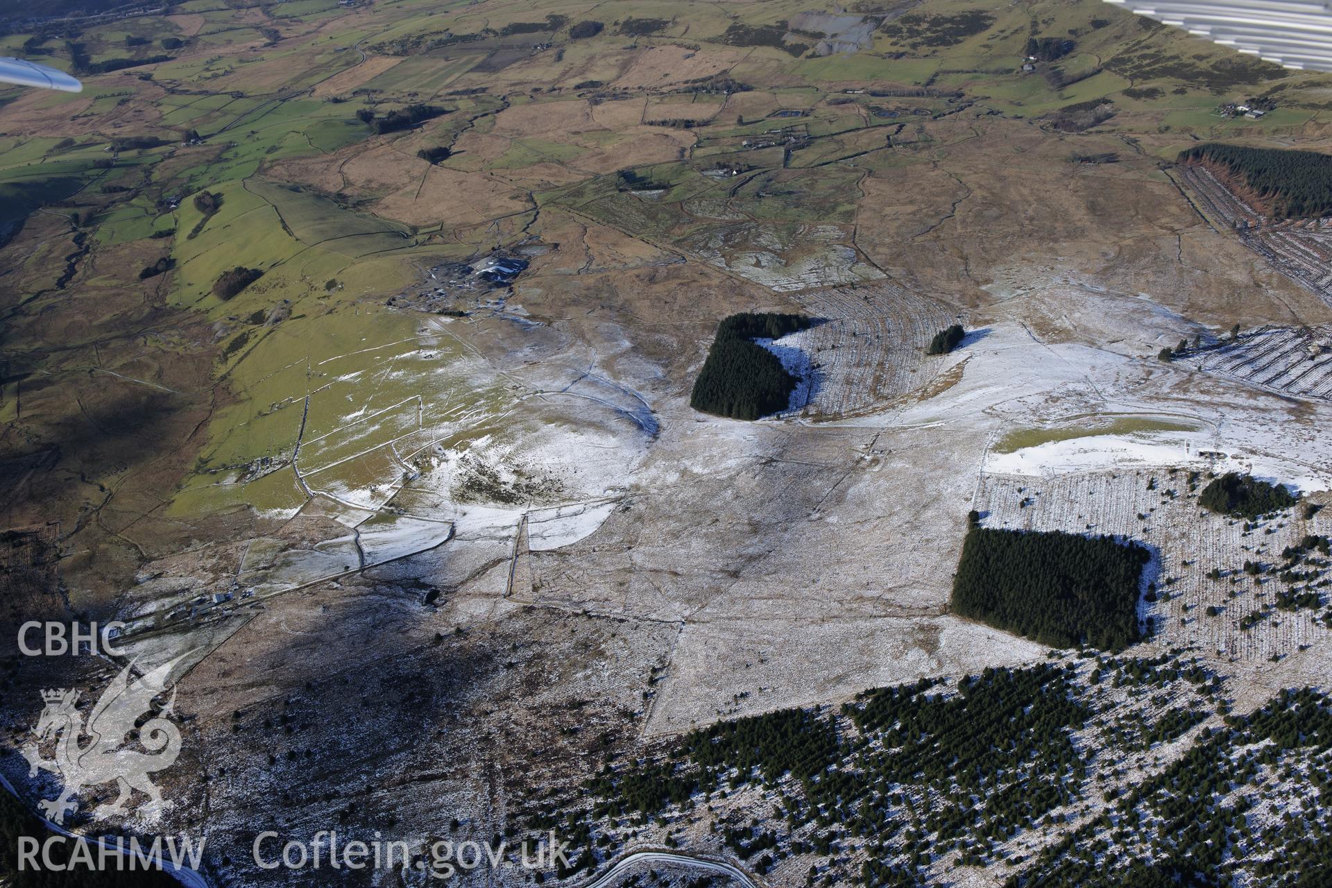 Esgair Mwun lead mines spoil tip and field boundaries north of Bryn-Coryn Farmstead, Esgair Ddu. Oblique aerial photograph taken during the Royal Commission's programme of archaeological aerial reconnaissance by Toby Driver on 4th February 2015.