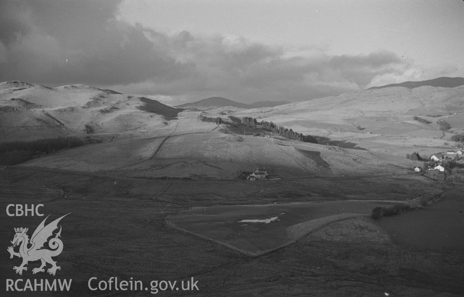 Digital copy of a black and white negative showing view from the Ystumtuen road at the north end of the Hen Riw; Ponterwyd on extreme right. Photographed by Arthur O. Chater in January 1968. (Looking north from Grid Reference SN 742 799).