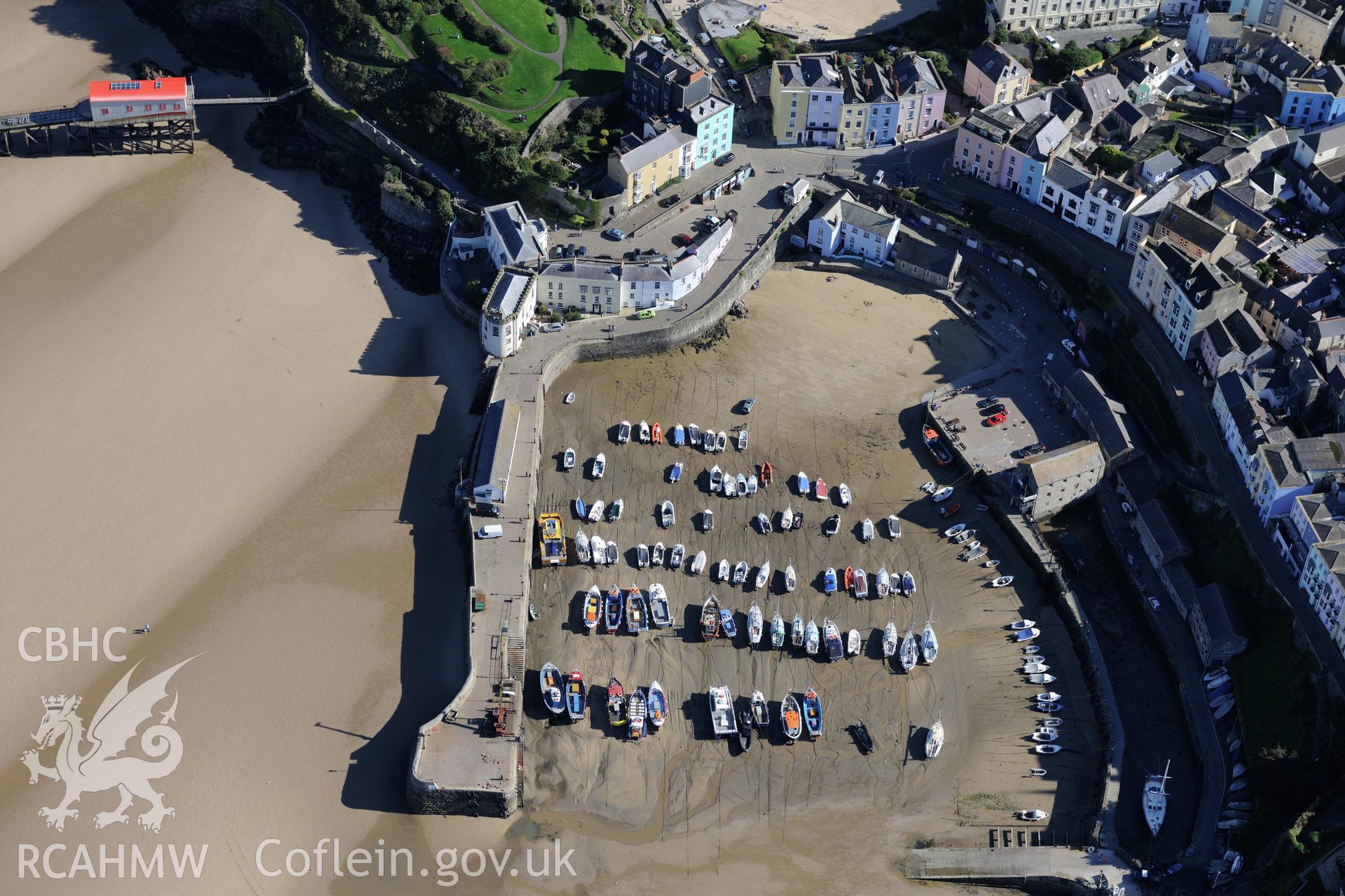 Tenby, its harbour and lifeboat station. Oblique aerial photograph taken during the Royal Commission's programme of archaeological aerial reconnaissance by Toby Driver on 30th September 2015.