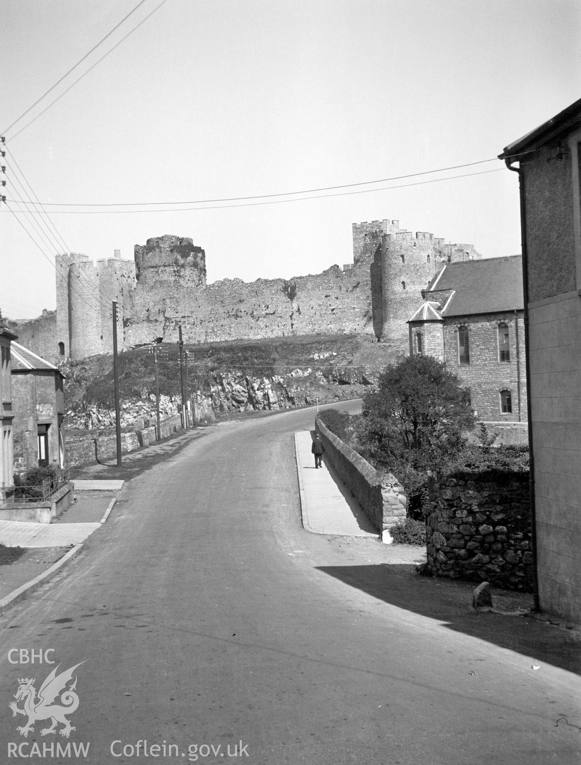 Digital copy of a nitrate negative showing view of the approach to Pembroke Castle. From the National Building Record Postcard Collection.