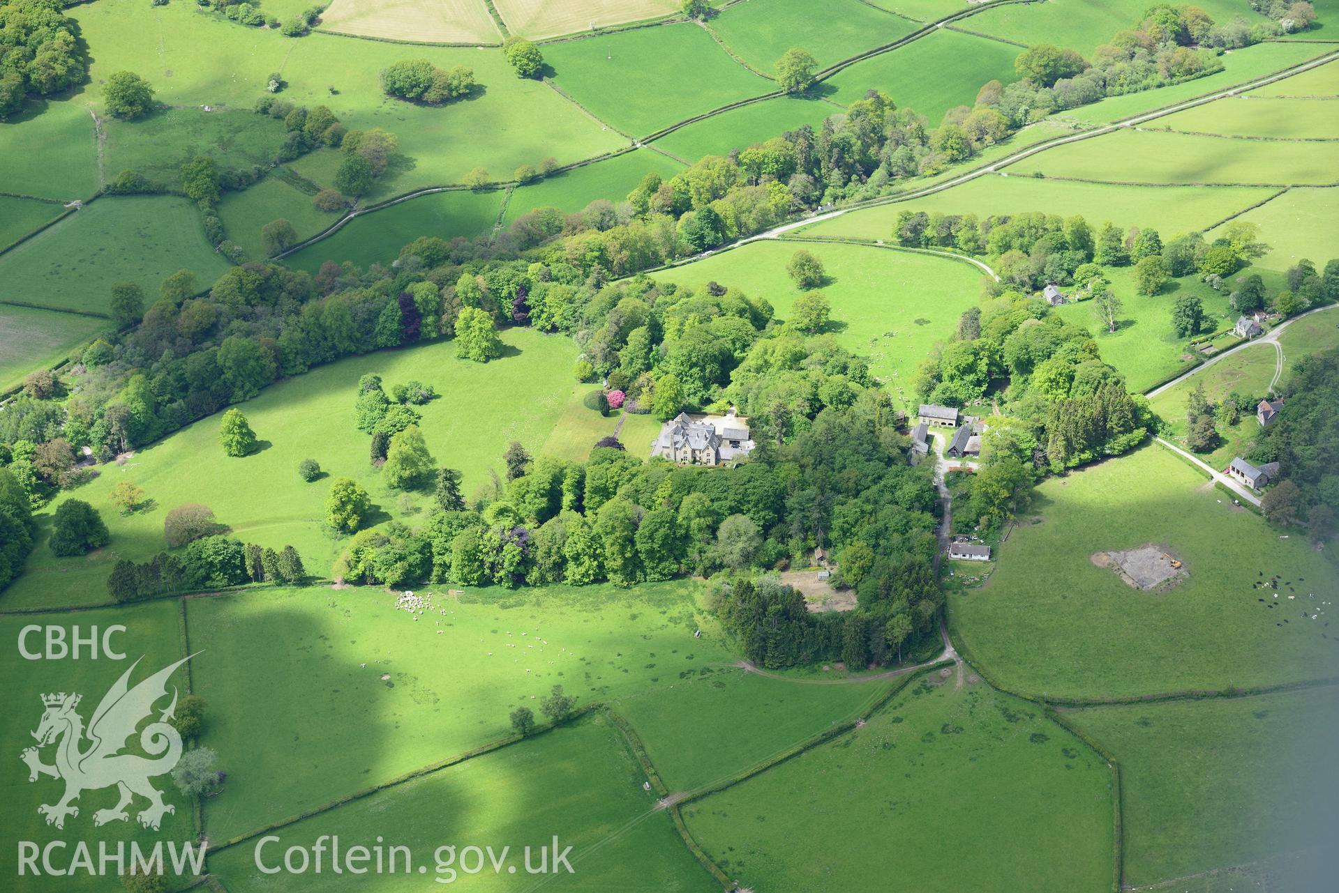 Derw country house and garden and Derw home farm including cowhouse, barn, sawmill, stable and cartshed. Oblique aerial photograph taken during the Royal Commission's programme of archaeological aerial reconnaissance by Toby Driver on 3rd June 2015.