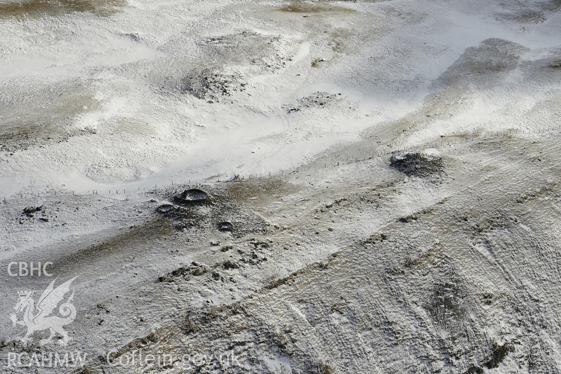 The central cairn and the south cairn on Pen Plynlimon Fawr, between Aberystwyth and Llangurig. Oblique aerial photograph taken during the Royal Commission's programme of archaeological aerial reconnaissance by Toby Driver on 4th February 2015.