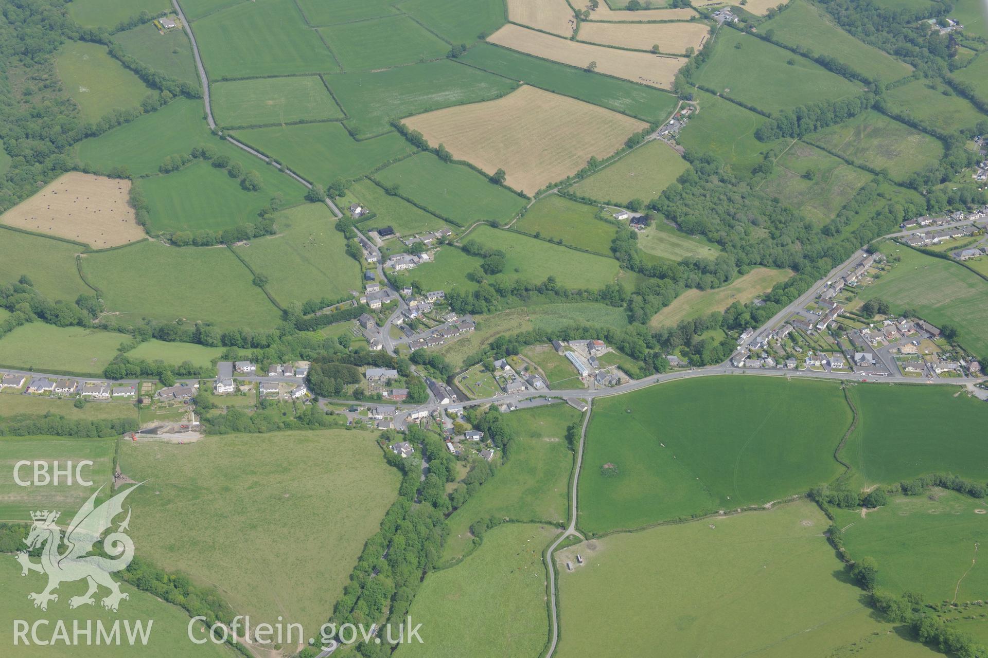Meidrim village, Carmarthenshire. Oblique aerial photograph taken during the Royal Commission's programme of archaeological aerial reconnaissance by Toby Driver on 11th June 2015.