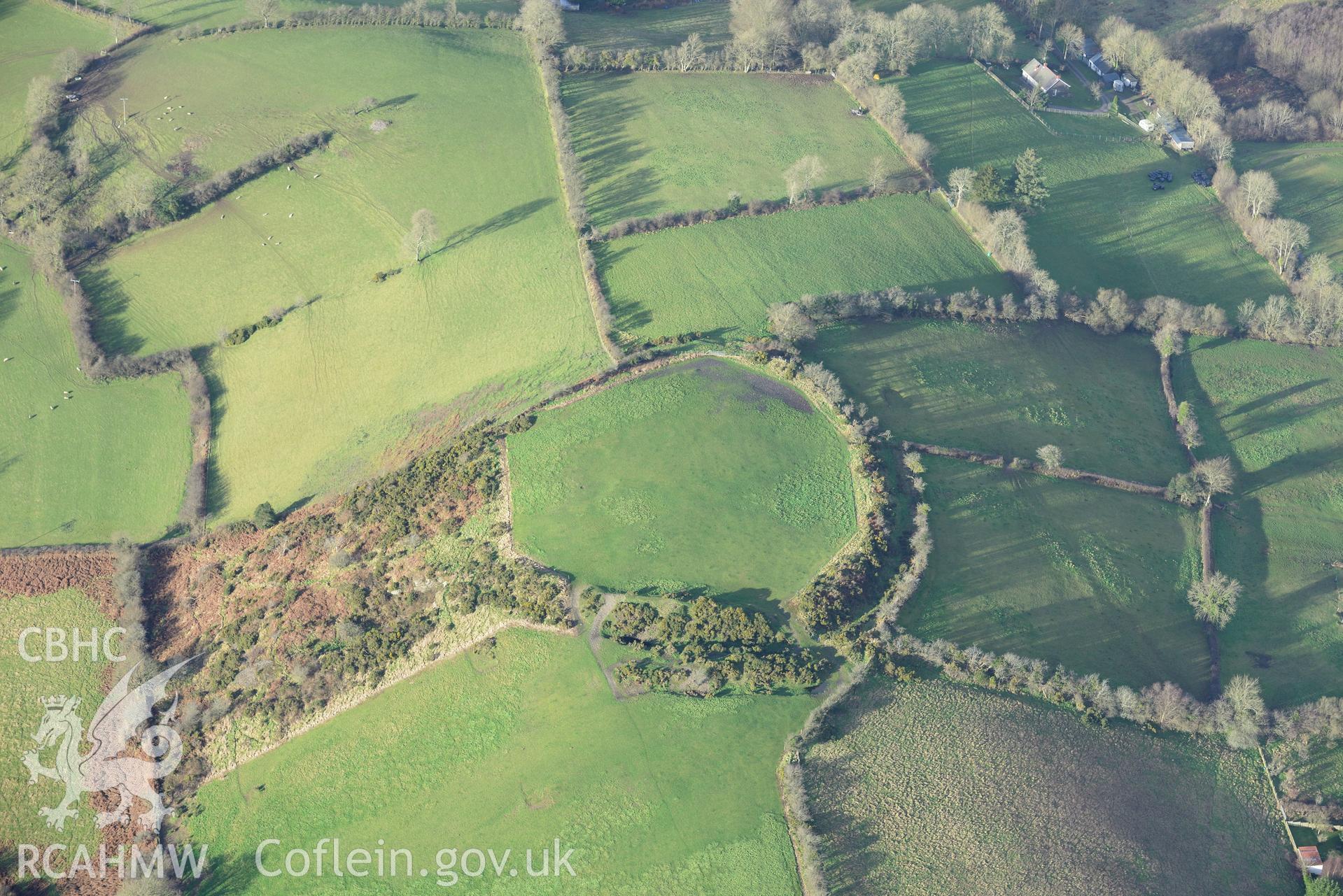 Cribyn village and Gaer Maesmynach hill fort. Oblique aerial photograph taken during the Royal Commission's programme of archaeological aerial reconnaissance by Toby Driver on 6th January 2015.