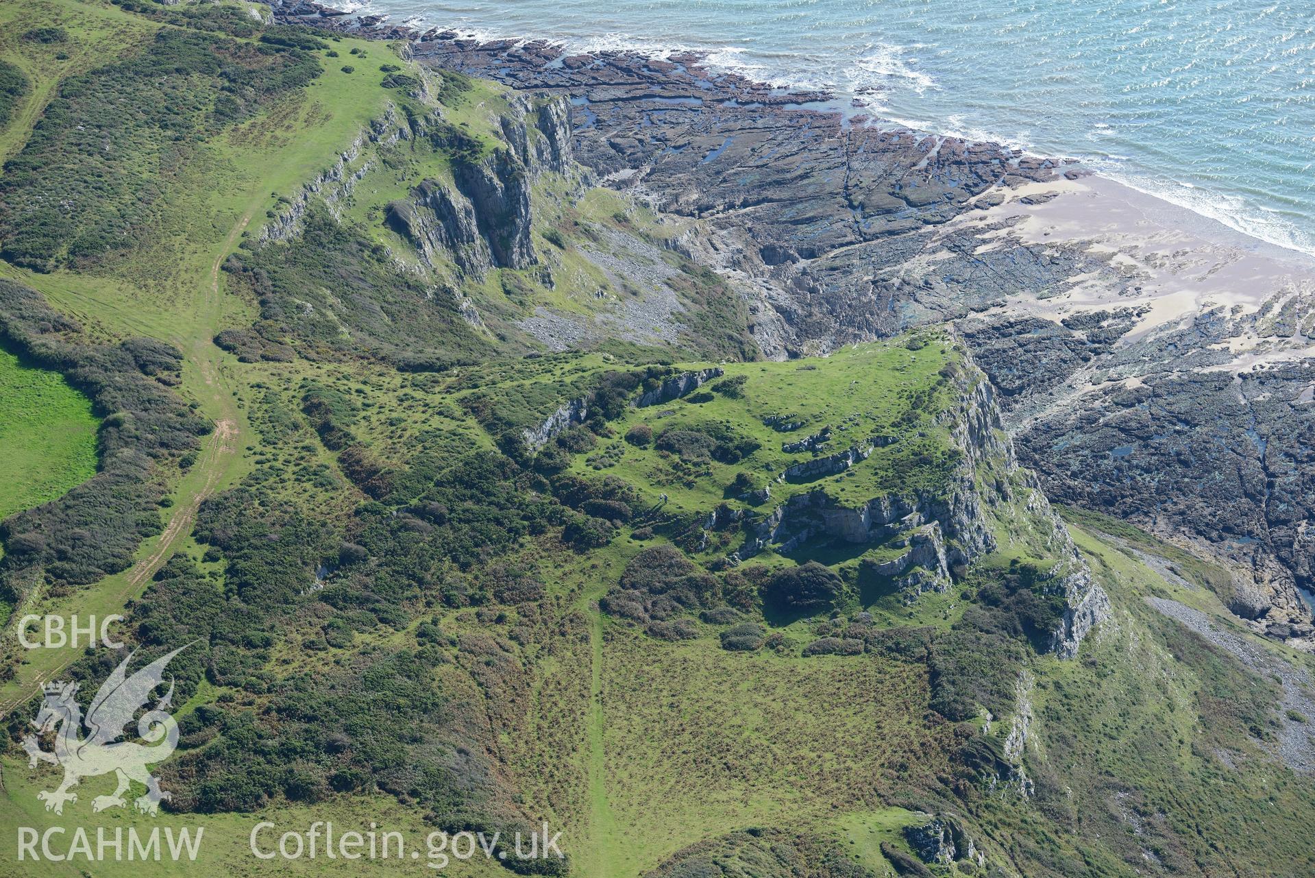 High Pennard hillfort on Pwlldu Head cliffs, on the southern coast of the Gower Peninsula. Oblique aerial photograph taken during the Royal Commission's programme of archaeological aerial reconnaissance by Toby Driver on 30th September 2015.