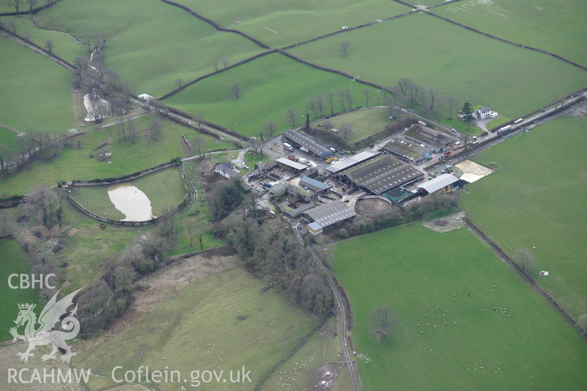 Castell Malgwyn farmhouse and outbuildings at Castell Malgwyn model farm. Oblique aerial photograph taken during the Royal Commission's programme of archaeological aerial reconnaissance by Toby Driver on 13th March 2015.