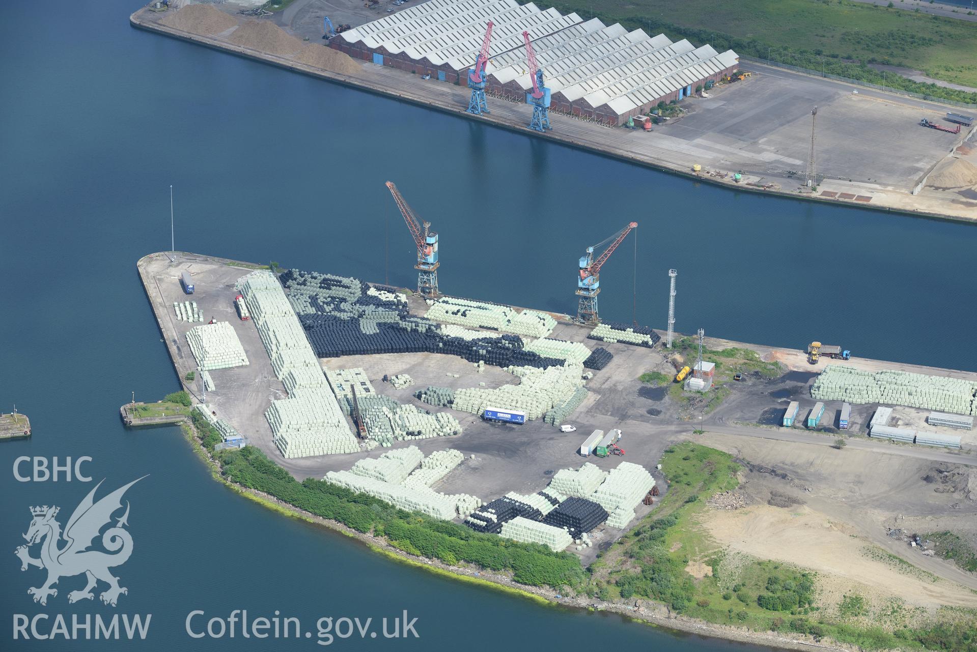 Workshops around the King's dock at Swansea Docks. Oblique aerial photograph taken during the Royal Commission's programme of archaeological aerial reconnaissance by Toby Driver on 19th June 2015.