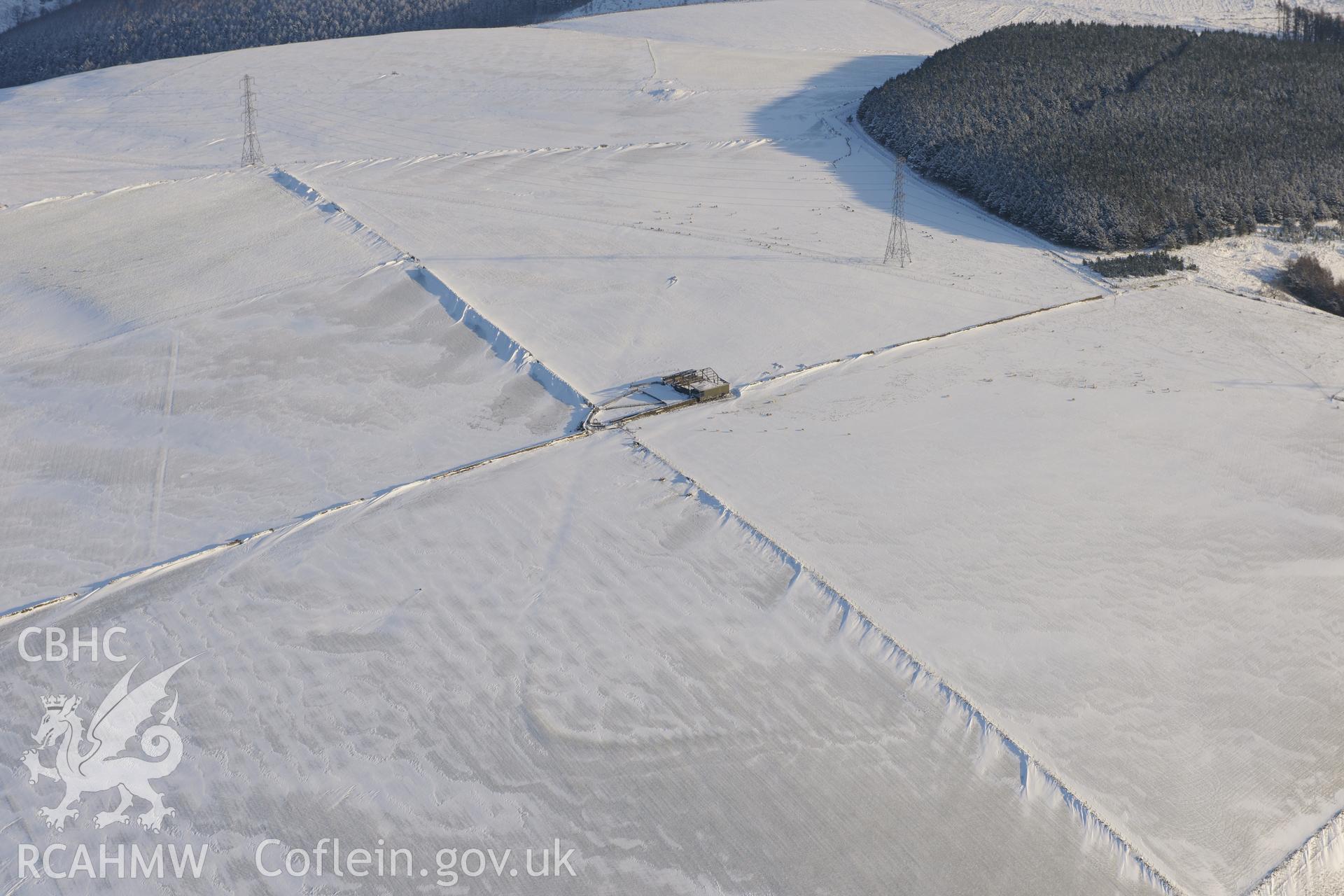 Mynydd Brombil enclosure earthwork, on the eastern edge of Margam Forest, Margam, Port Talbot. Oblique aerial photograph taken during the Royal Commission?s programme of archaeological aerial reconnaissance by Toby Driver on 24th January 2013.