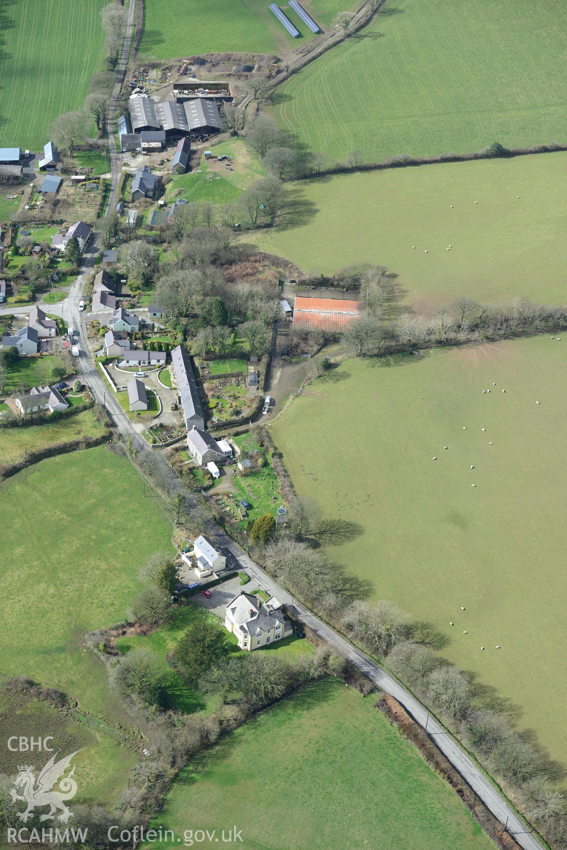 The modern village of New Moat and the site of New Moat shrunken village. Oblique aerial photograph taken during the Royal Commission's programme of archaeological aerial reconnaissance by Toby Driver on 13th March 2015.