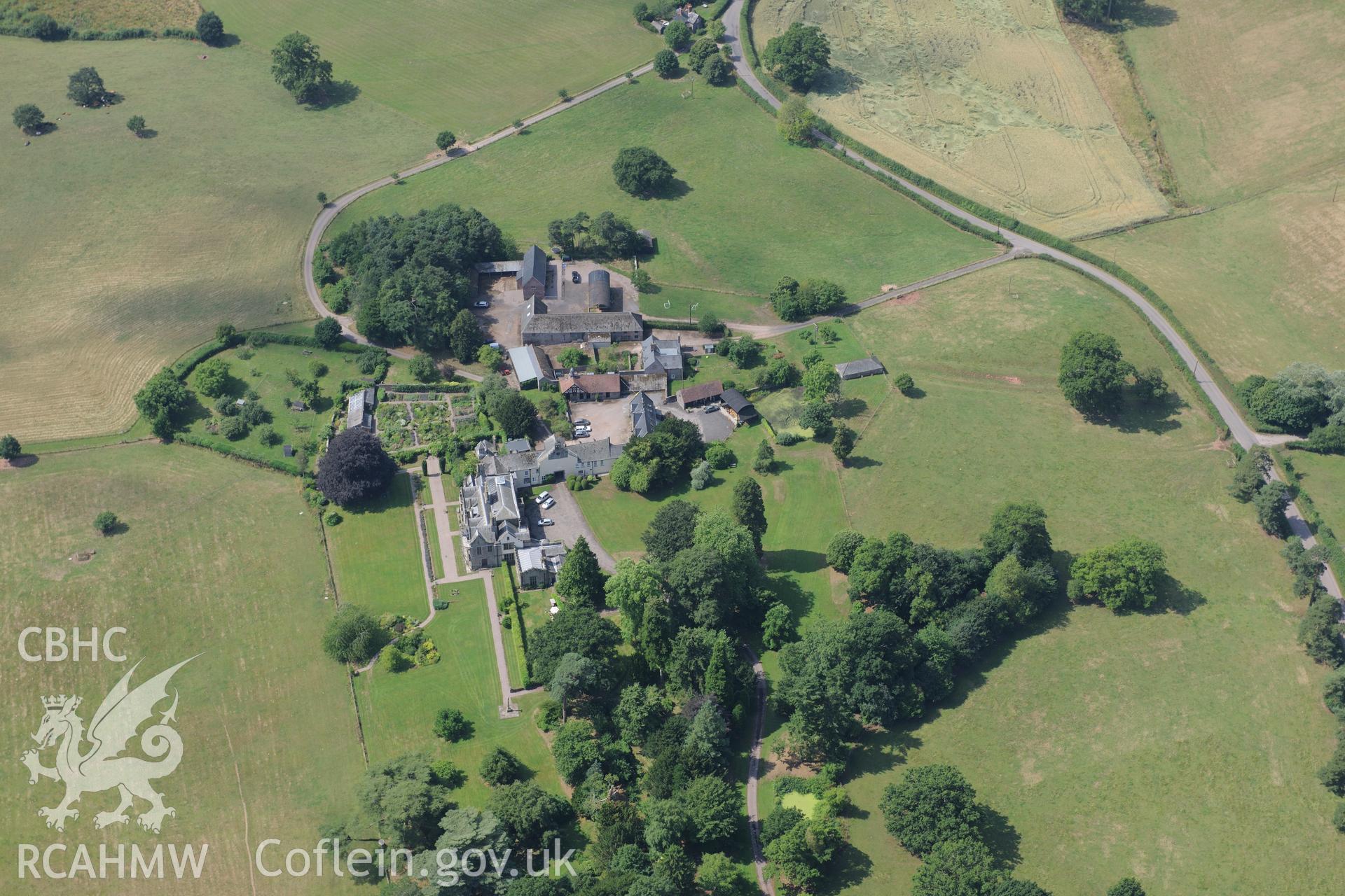 Dingestow court, barns and garden, Dingestow, south west of Monmouth. Oblique aerial photograph taken during the Royal Commission?s programme of archaeological aerial reconnaissance by Toby Driver on 1st August 2013.