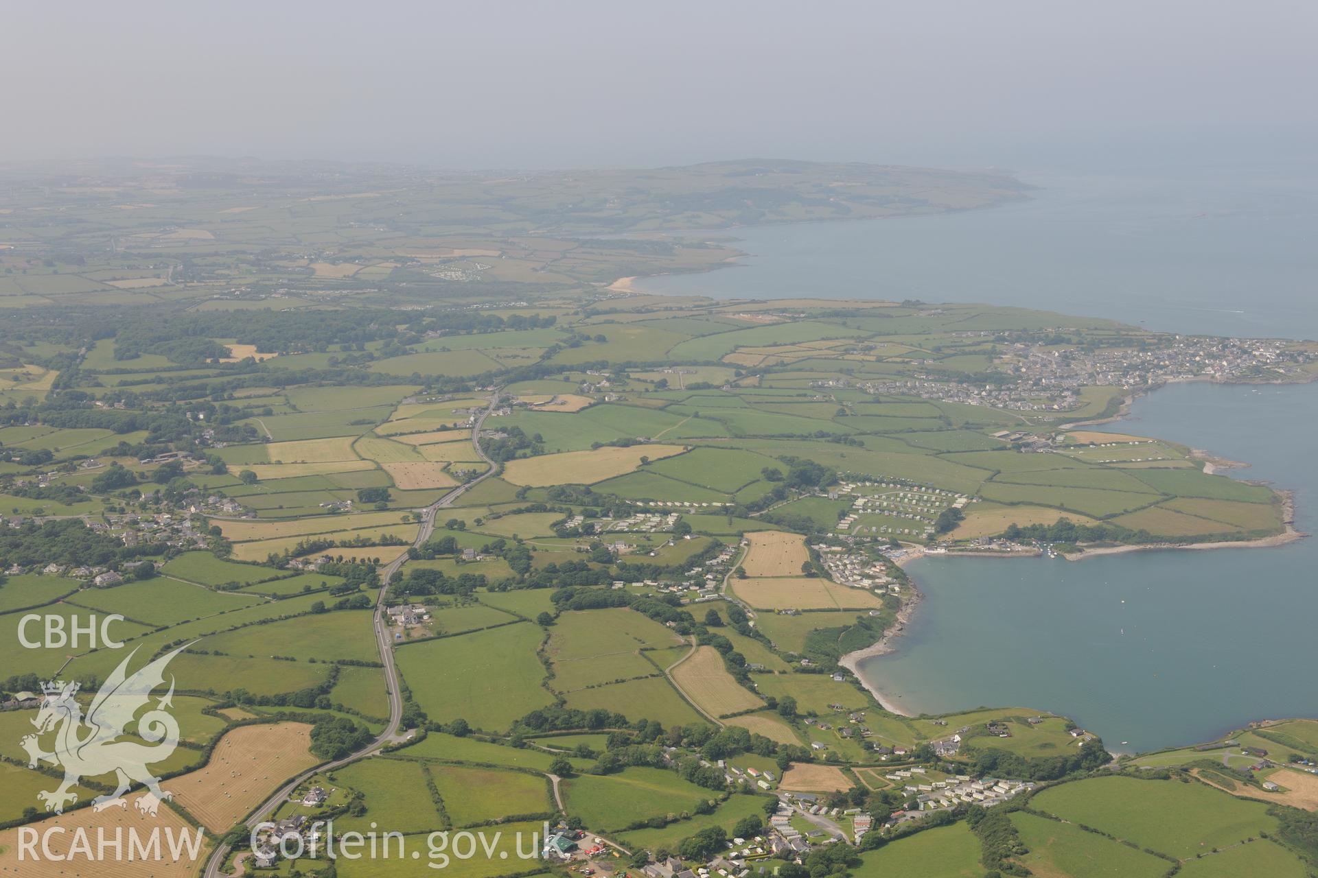 The town of Moelfre, on the east coast of Anglesey. Oblique aerial photograph taken during the Royal Commission?s programme of archaeological aerial reconnaissance by Toby Driver on 12th July 2013.