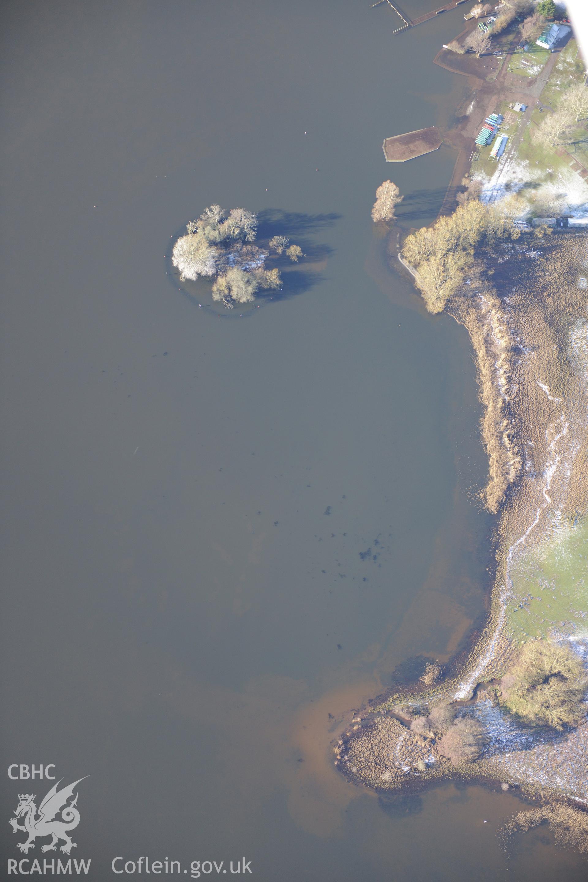 The Welsh Crannog Centre on the shores of Llangorse lake and Llangors Crannog in Llangorse lake, south east of Brecon. Oblique aerial photograph taken during Royal Commission?s programme of archaeological aerial reconnaissance by Toby Driver on 15/01/2013.