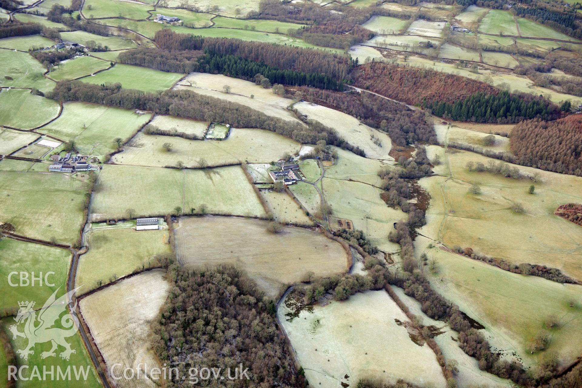 Llwynywormwood Farmstead, south of Llandovery. Oblique aerial photograph taken during the Royal Commission?s programme of archaeological aerial reconnaissance by Toby Driver on 15th January 2013.