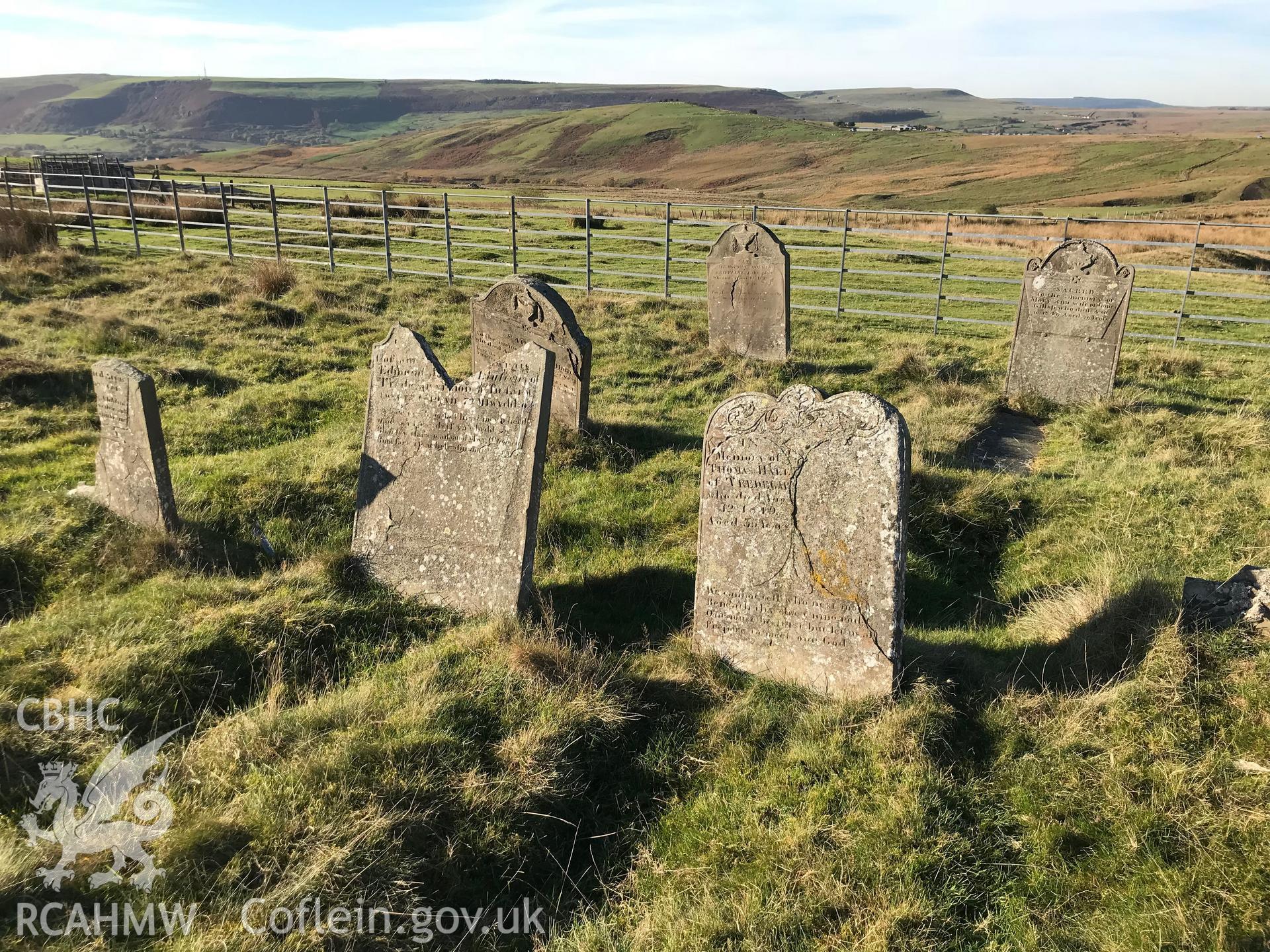 Detailed view of gravestones at the Tredegar Ironworks cholera cemetery. Colour photograph taken by Paul R. Davis on 24th October 2018.