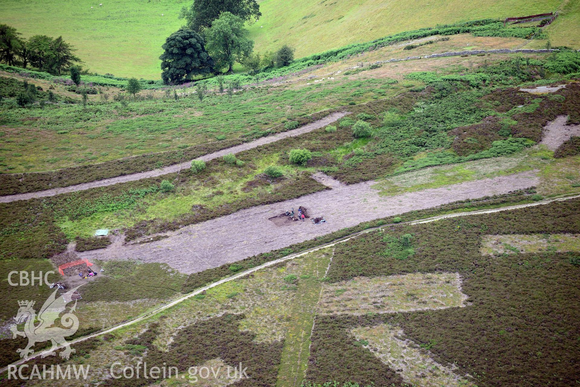 Moel Arthur Hillfort. Excavation by Liverpool University. Oblique aerial photograph taken during the Royal Commission's programme of archaeological aerial reconnaissance by Toby Driver on 30th July 2015.