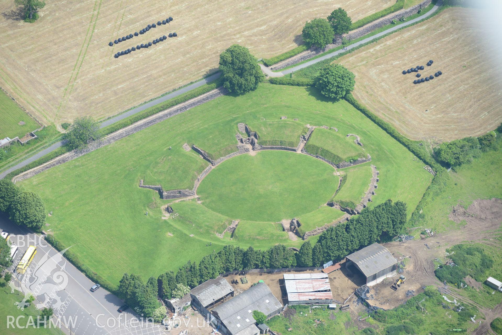 Caerleon town including views of the Roman barracks and amphitheatre. Oblique aerial photograph taken during the Royal Commission's programme of archaeological aerial reconnaissance by Toby Driver on 11th June 2015.