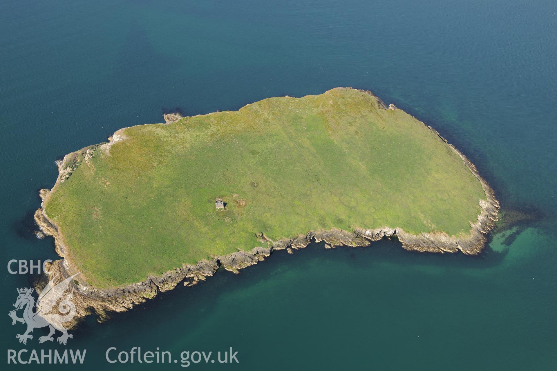 The chapel building and the footings of a priory hall at St. Tudwal's Island East. Oblique aerial photograph taken during the Royal Commission's programme of archaeological aerial reconnaissance by Toby Driver on 23rd June 2015.