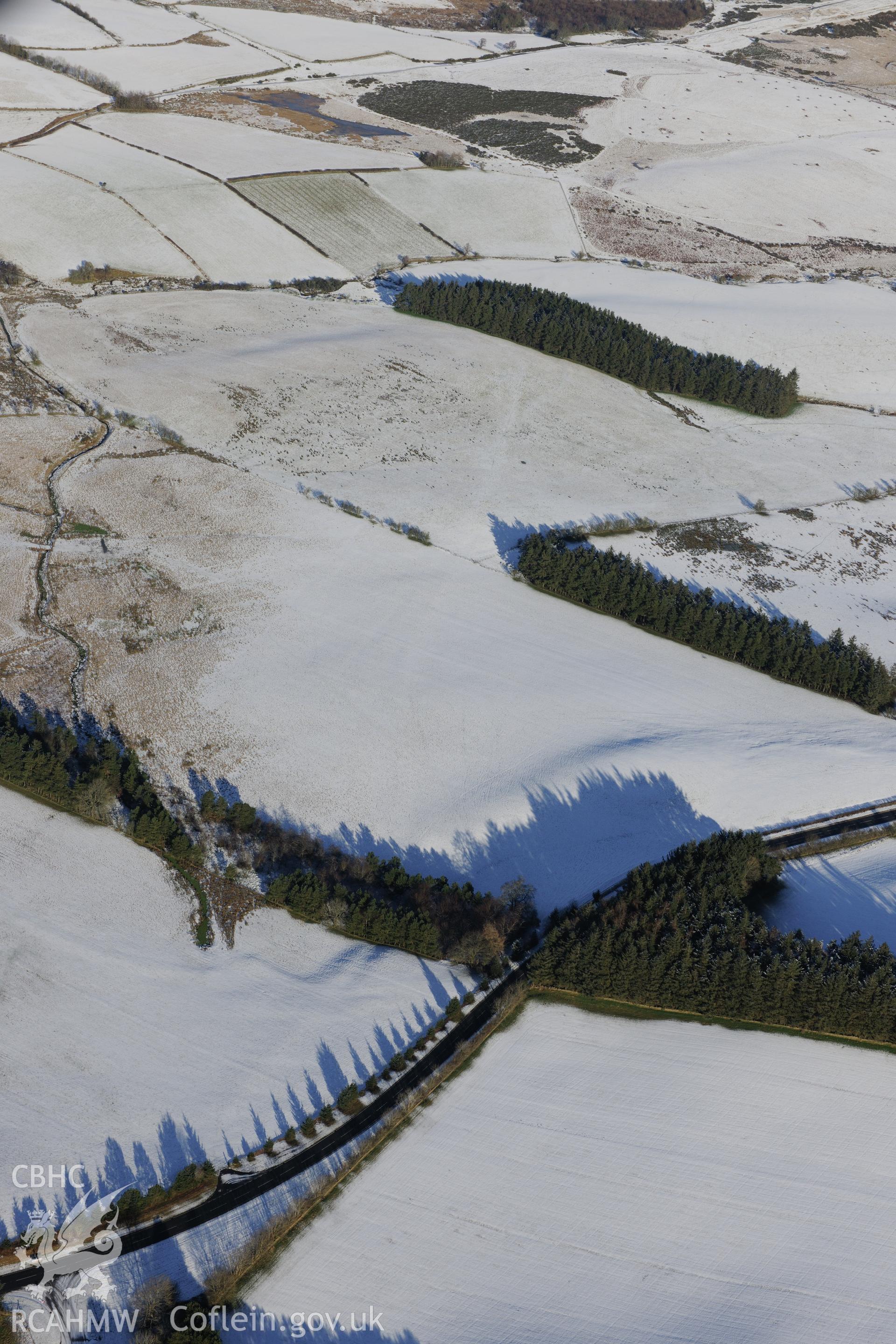 The south western section of the Roman road on Mynydd Illtyd, south west of Brecon. Oblique aerial photograph taken during the Royal Commission?s programme of archaeological aerial reconnaissance by Toby Driver on 15th January 2013.