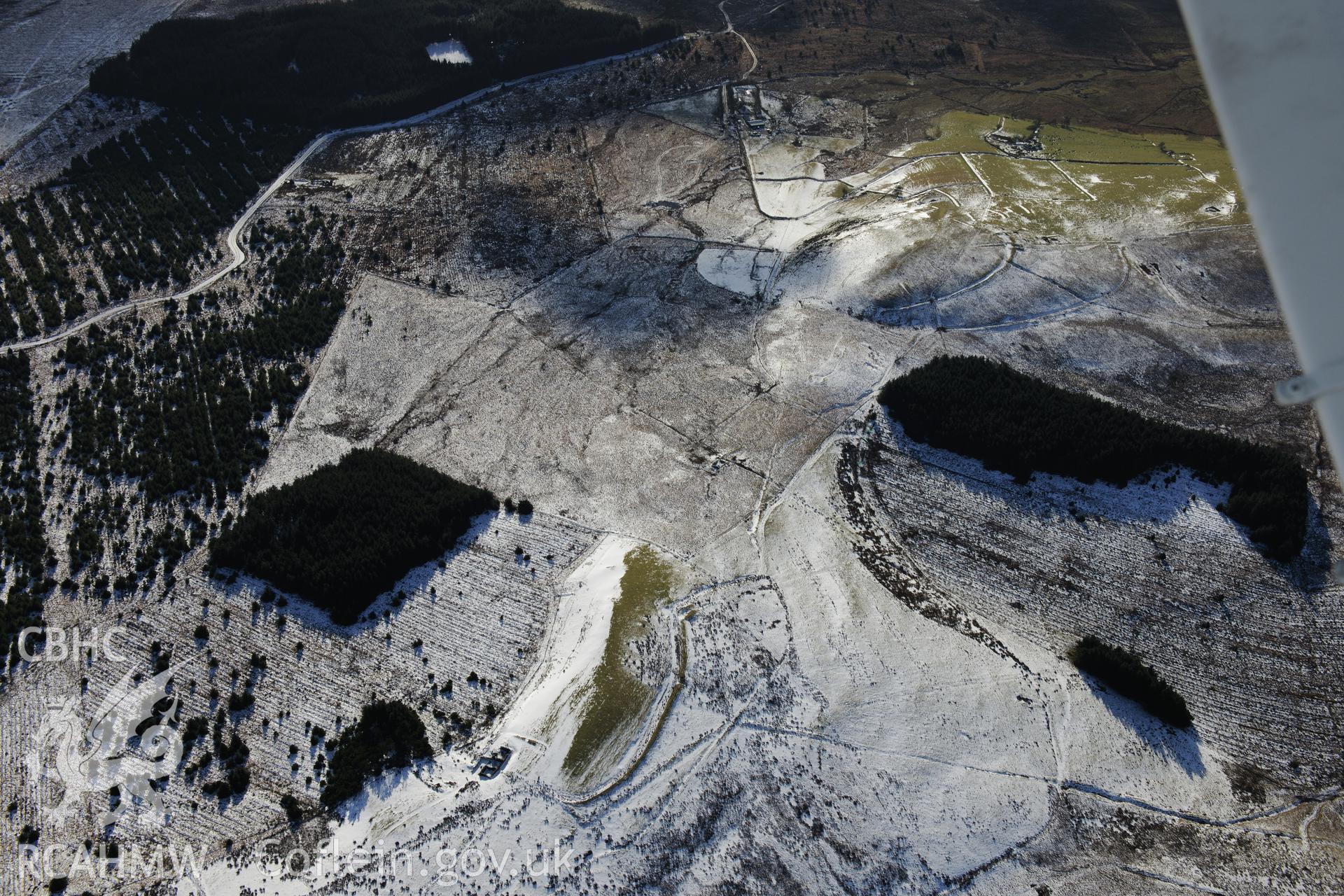 Field boundaries north of Bryn-Coryn Farmstead, Esgair Ddu. Oblique aerial photograph taken during the Royal Commission's programme of archaeological aerial reconnaissance by Toby Driver on 4th February 2015.