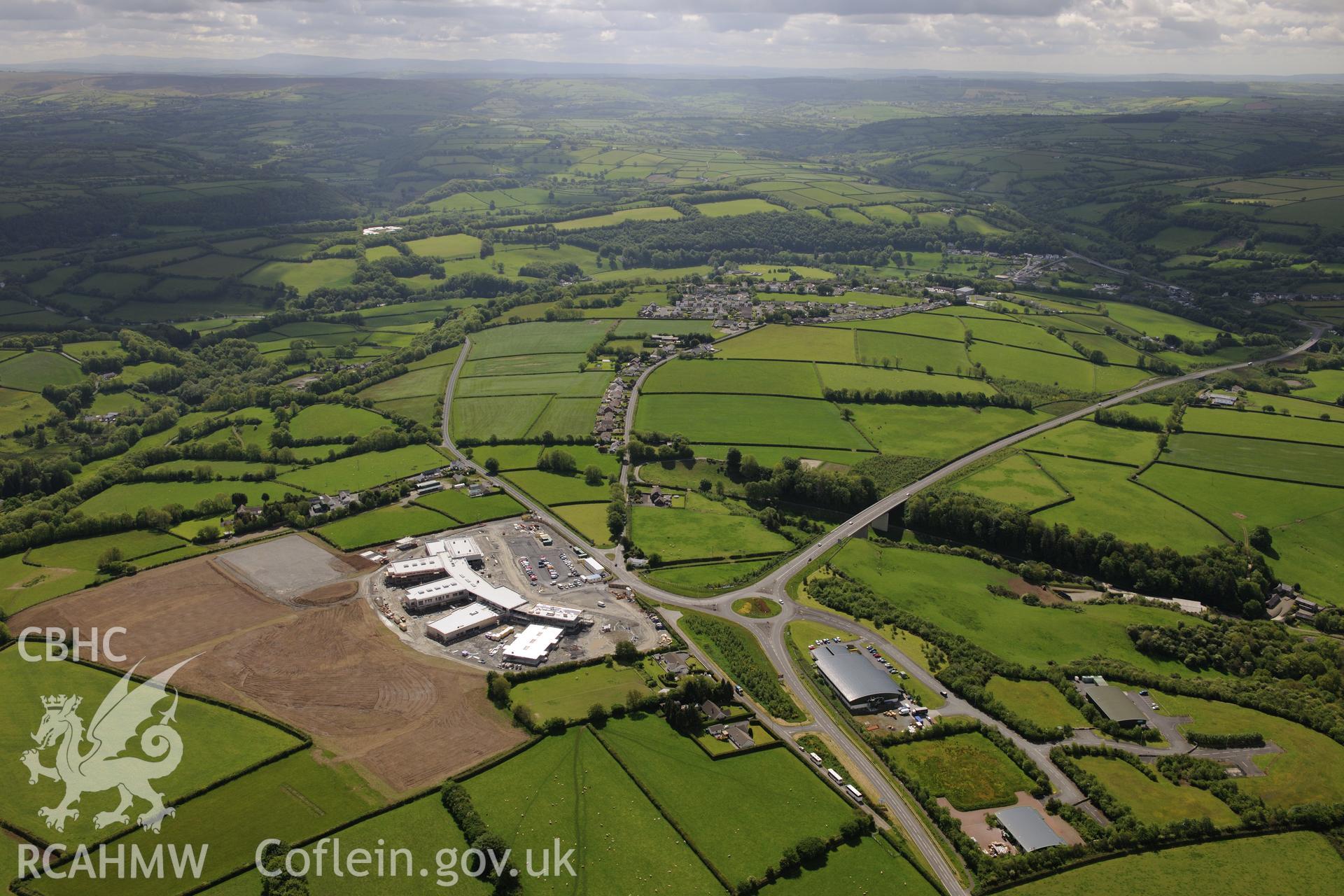 Landscape view showing Ysgol Bro Teifi, Llandysul bypass and Llandysul town. Oblique aerial photograph taken during the Royal Commission's programme of archaeological aerial reconnaissance by Toby Driver on 3rd June 2015.