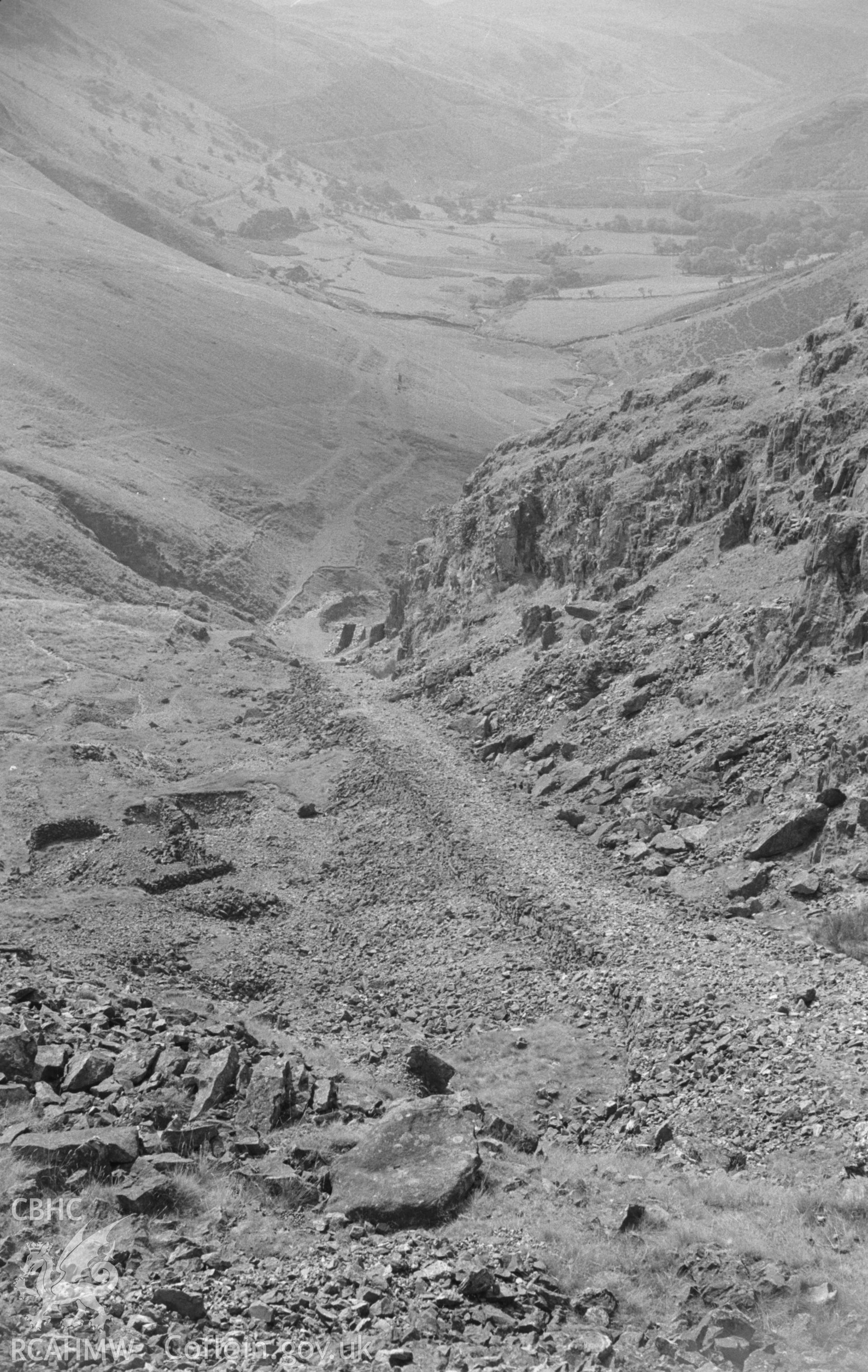 Digital copy of black and white negative showing view looking down the incline of the upper part of the Plynlimon and Hafan Tramway, through the mine workings. Photographed by Arthur O. Chater in August 1965 from Grid Reference SN 7320 8802, looking west.