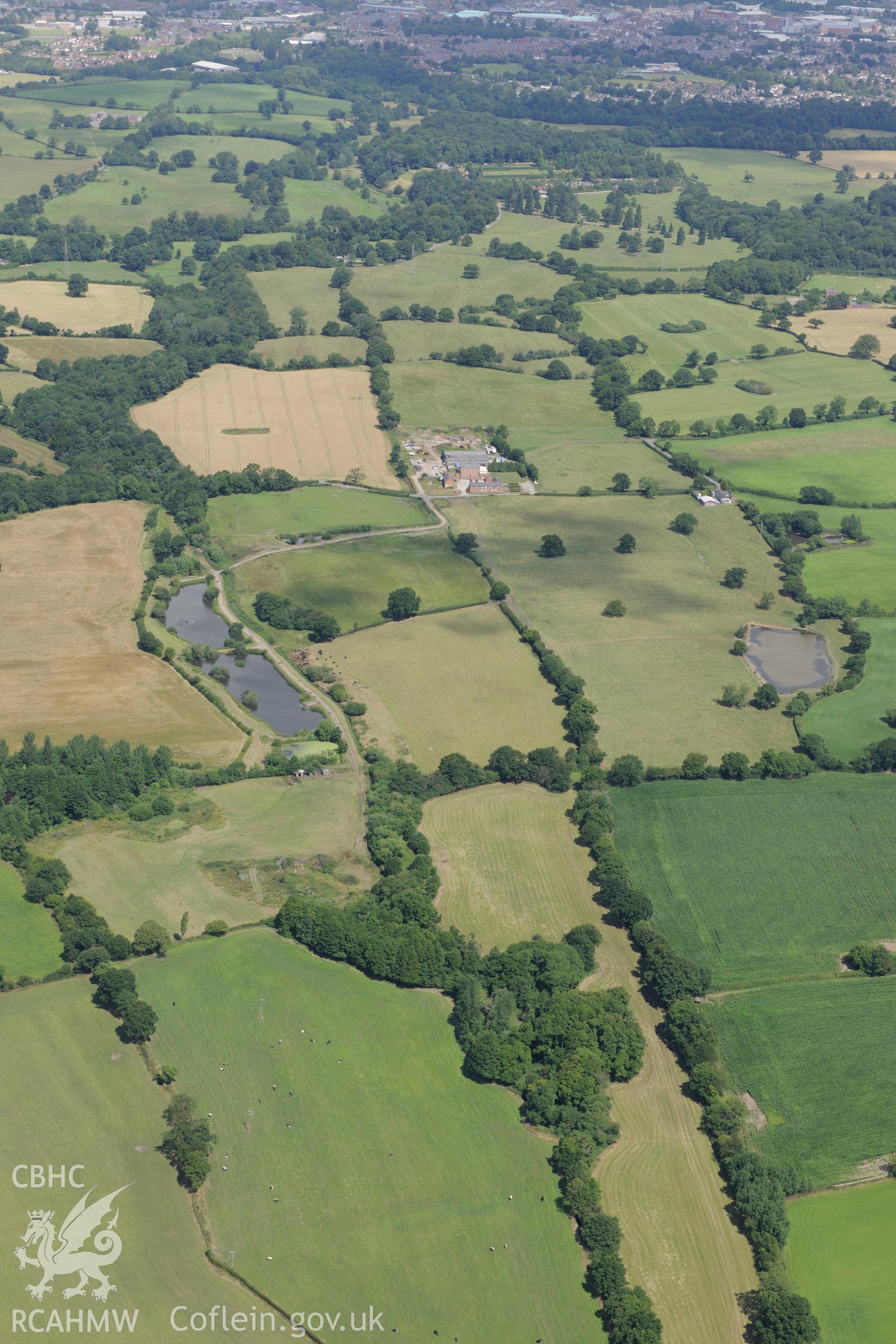 Middle Sontley Farm and the section of Wat's Dyke extending from Middle Sontley to Black Brook Bridge. Oblique aerial photograph taken during the Royal Commission's programme of archaeological aerial reconnaissance by Toby Driver on 30th July 2015.