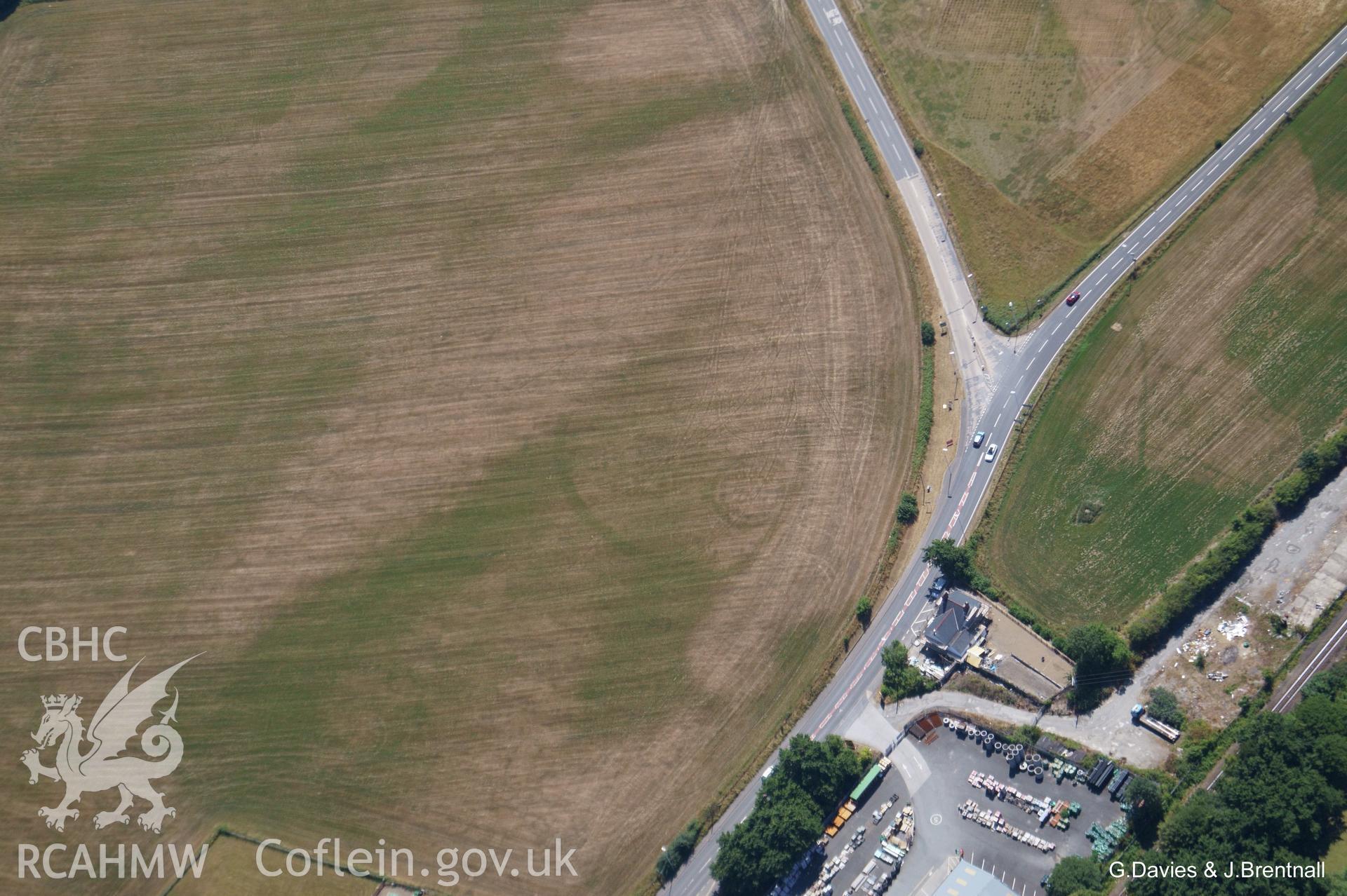 Aerial photograph showing the defended enclosure on the southern edge of Bow Street, Aberystwyth. Photographed by Glyn Davies and Jonathan Brentnall on 22nd July 2018 under drought conditions.