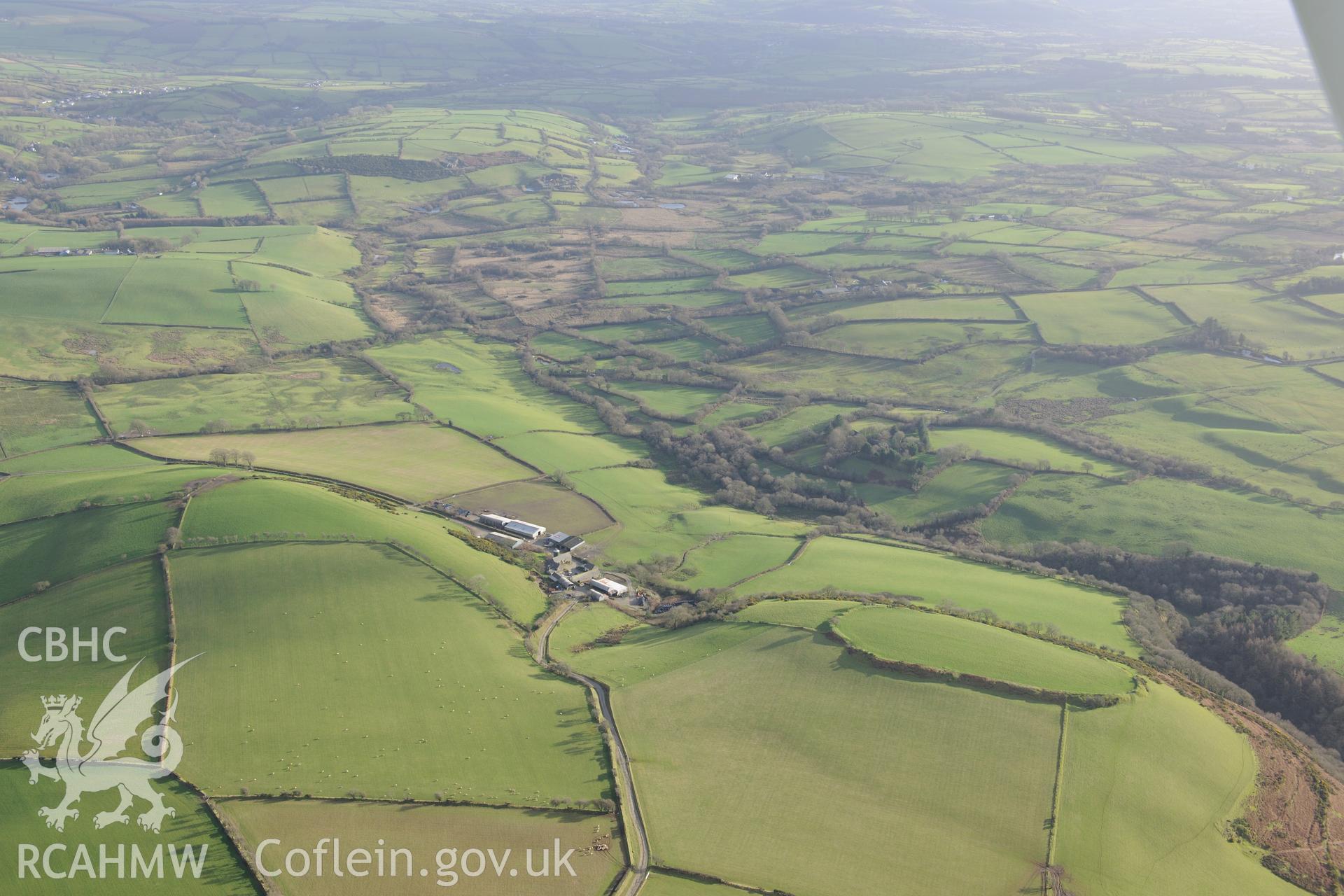 Castell Moedyn Defended Enclosure. Oblique aerial photograph taken during the Royal Commission's programme of archaeological aerial reconnaissance by Toby Driver on 6th January 2015