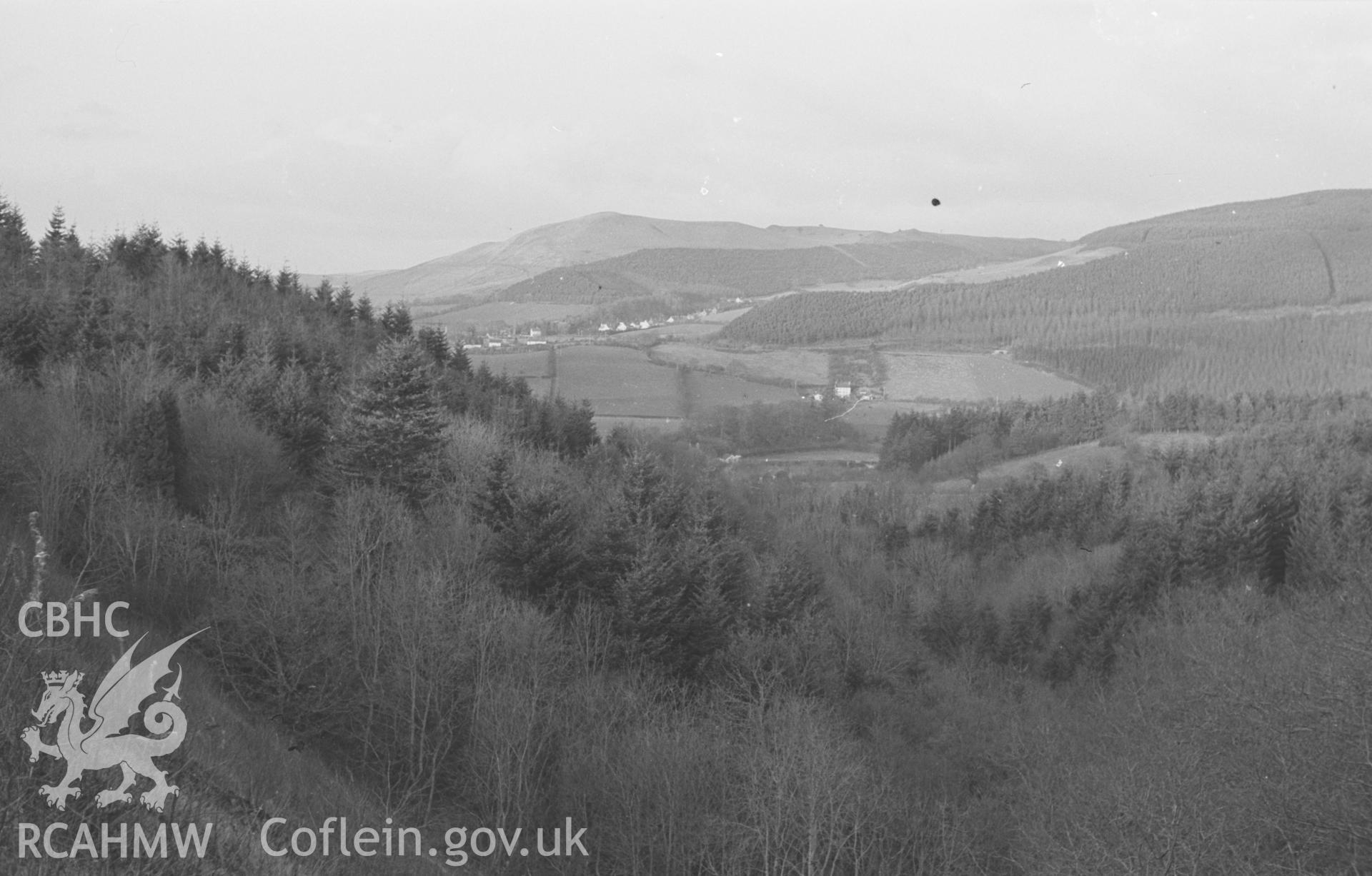 Digital copy of a black and white negative showing Llanafan from the disused railway embankment 800m south south west of Llanafan Bridge. Photographed by Arthur O. Chater on 1st January 1967 looking north from Grid Reference SN 6845 7050.