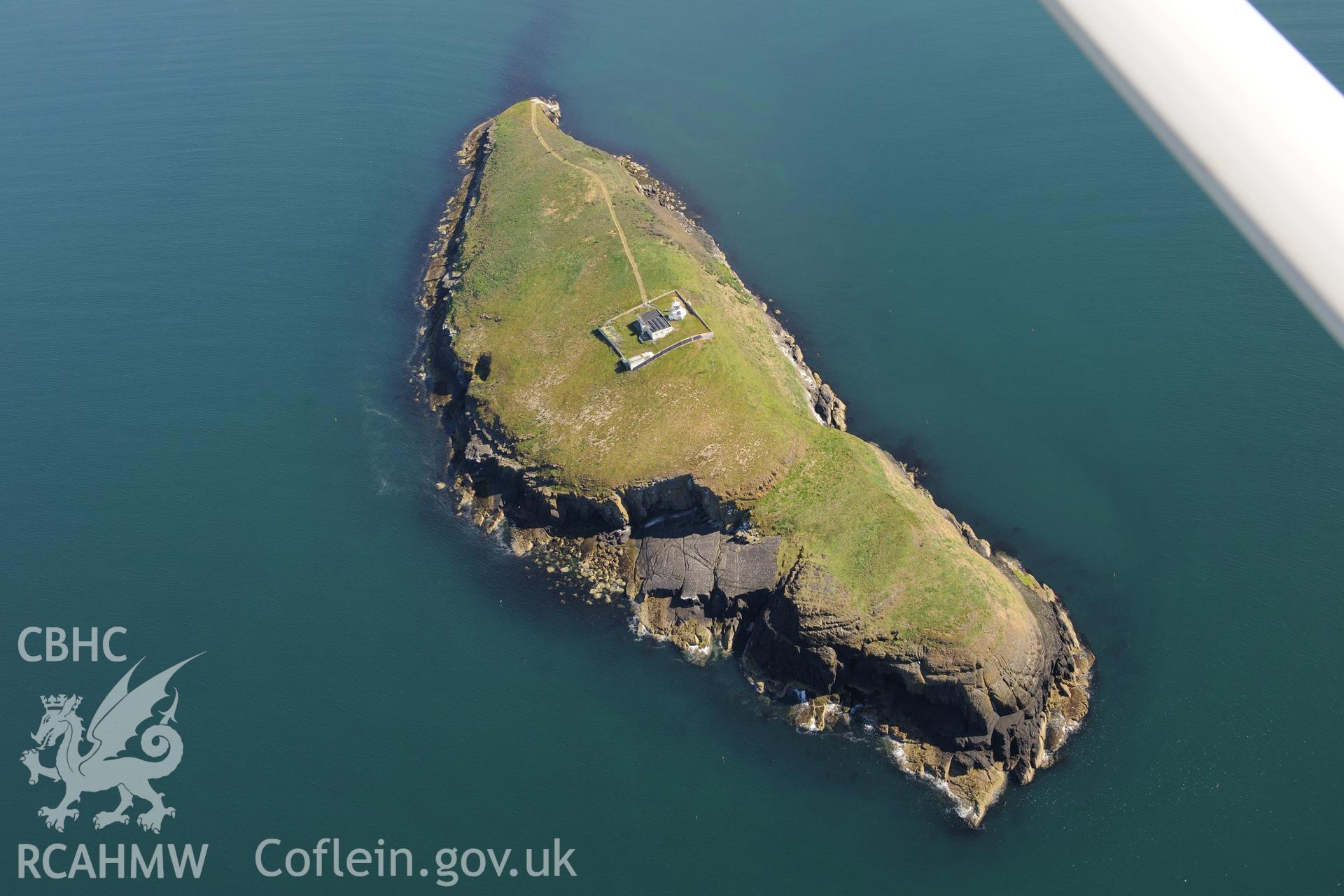 St Tudwal's Island West and its lighthouse. Oblique aerial photograph taken during the Royal Commission's programme of archaeological aerial reconnaissance by Toby Driver on 23rd June 2015.