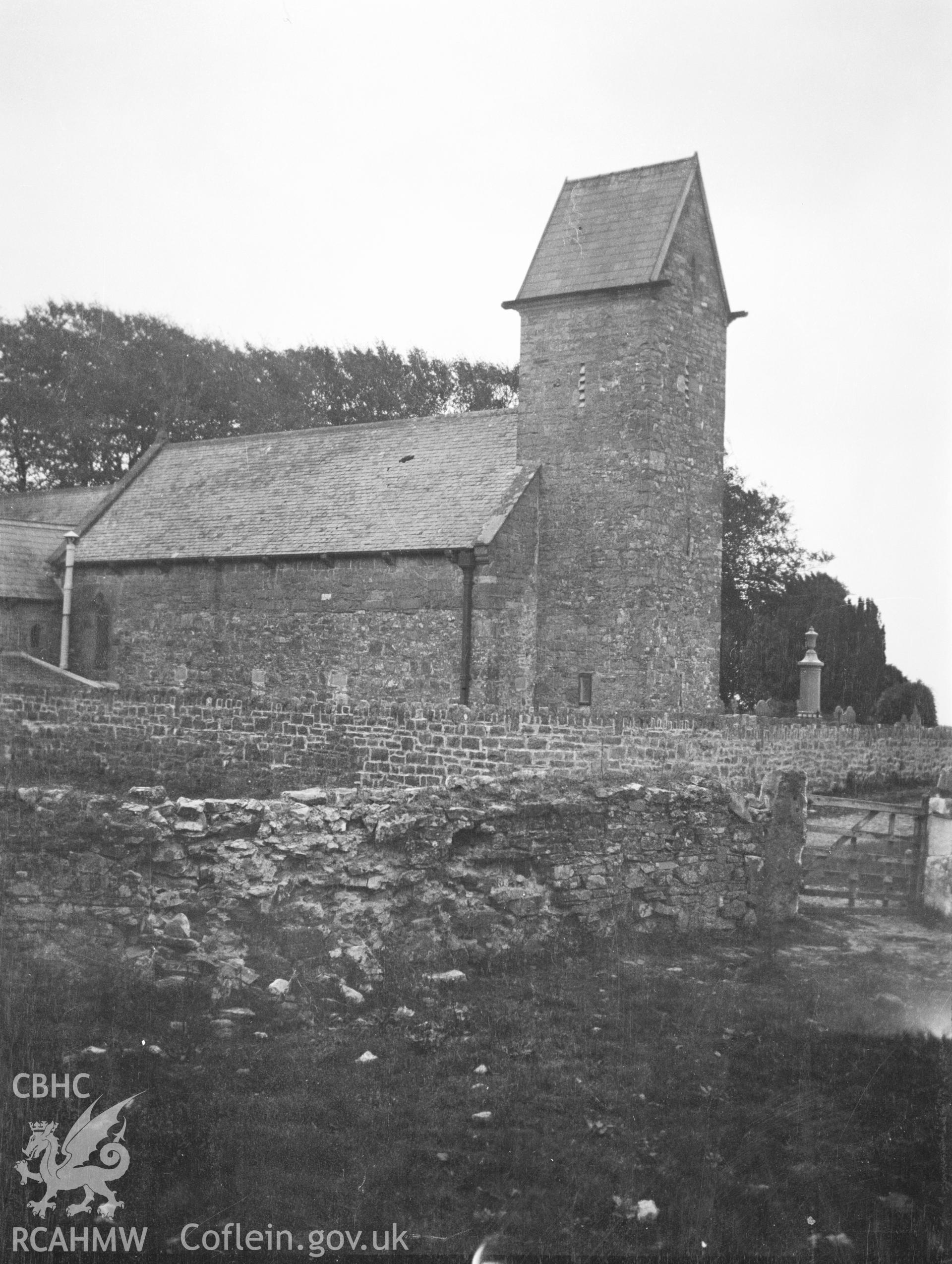 Digital copy of a nitrate negative showing exterior view of church and saddle-back tower from the north-west, St Teilo's Church, Pendine. From the National Building Record Postcard Collection.