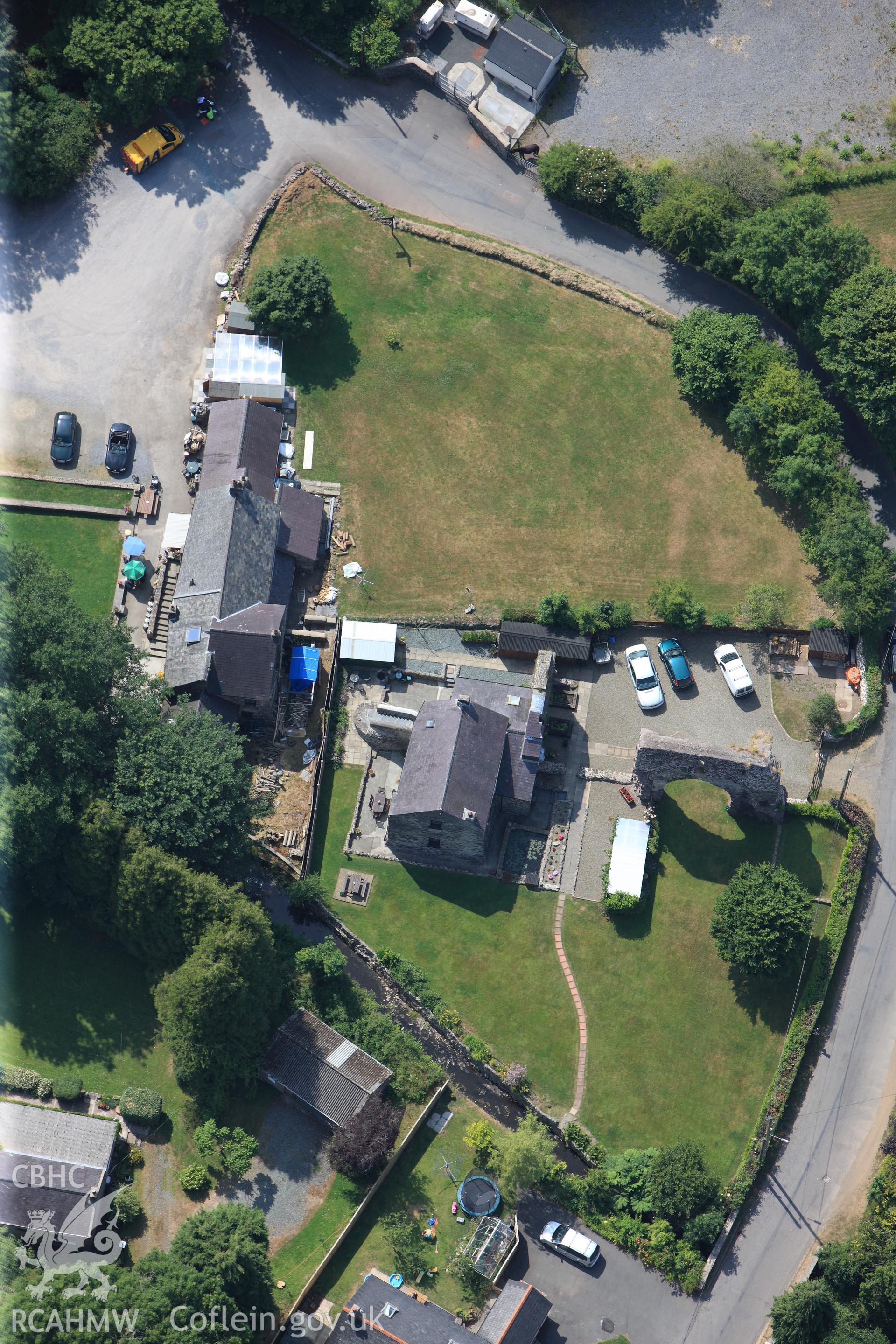 Priory of St Budoc and the Blessed Virgin, and Priory Farm, Milford Haven. Oblique aerial photograph taken during the Royal Commission?s programme of archaeological aerial reconnaissance by Toby Driver on 16th July 2013.