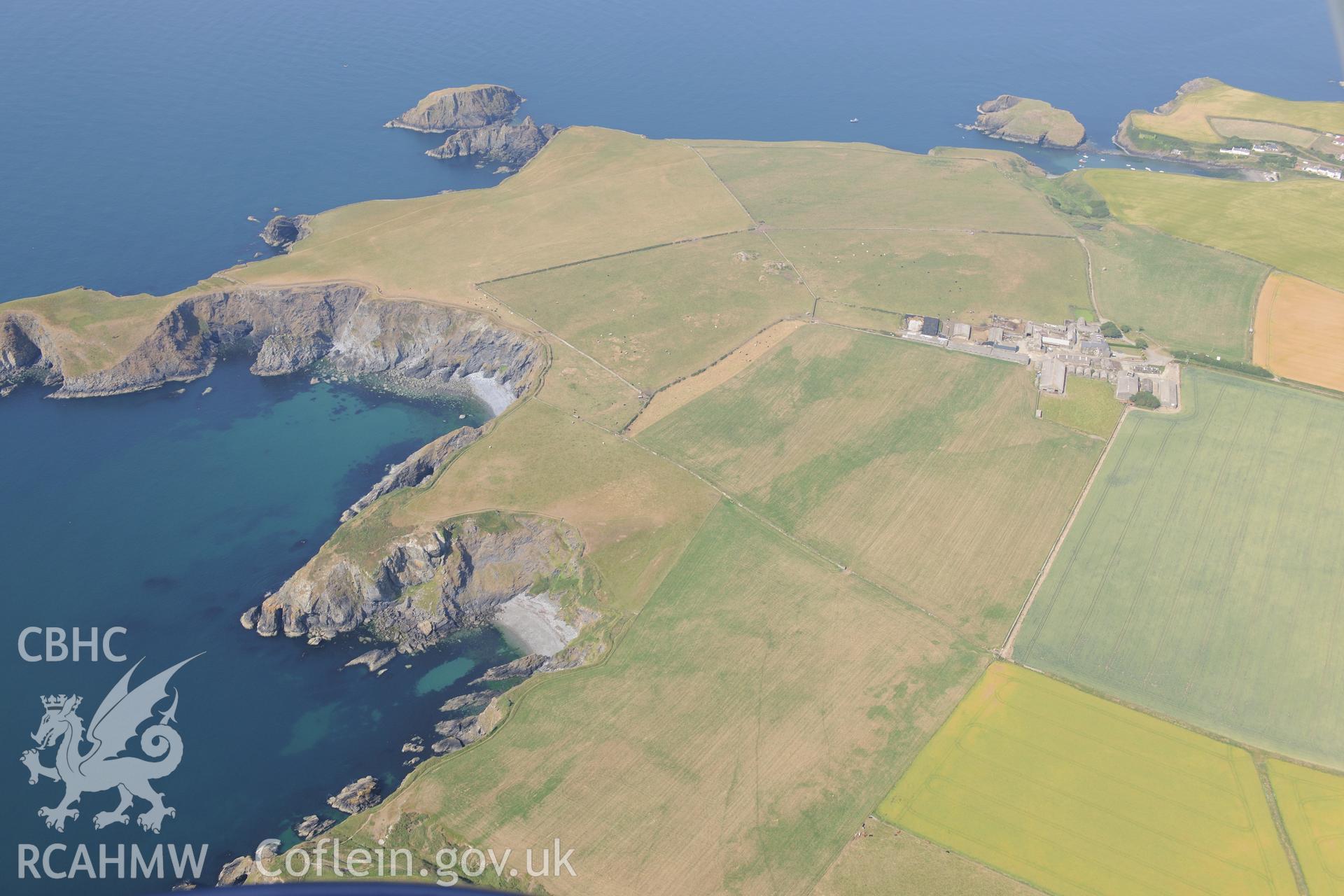 Quarry and site of longhouse at Abercastle, south west of Fishguard. Oblique aerial photograph taken during the Royal Commission?s programme of archaeological aerial reconnaissance by Toby Driver on 16th July 2013.