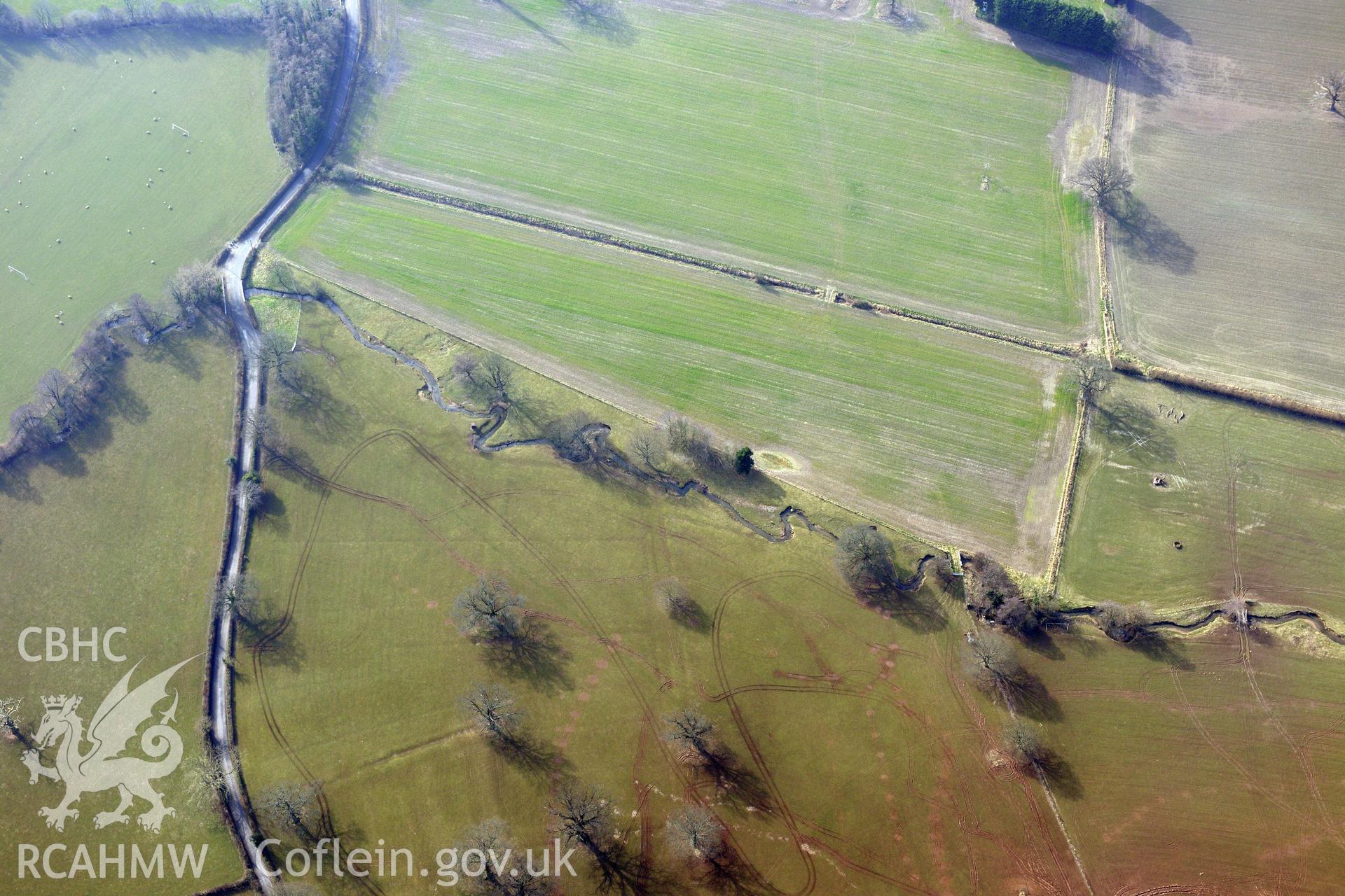 Plas Newydd Romano-British temple cropmark, Llanfair Dyffryn Clwyd, south east of Ruthin. Oblique aerial photograph taken during the Royal Commission?s programme of archaeological aerial reconnaissance by Toby Driver on 28th February 2013.